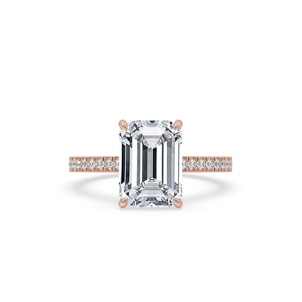 Emerald cut engagement ring with hidden halo design.
