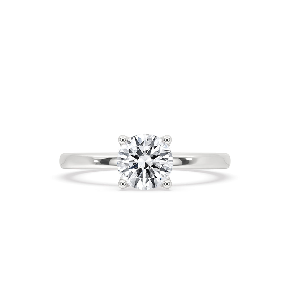 White gold solitaire engagement ring with round lab-grown diamond.
