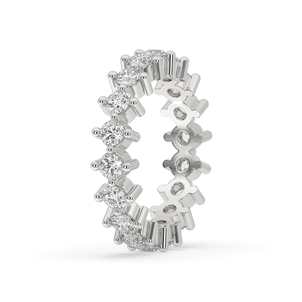 Shared prong band with round diamonds in a round diamond band setting.
