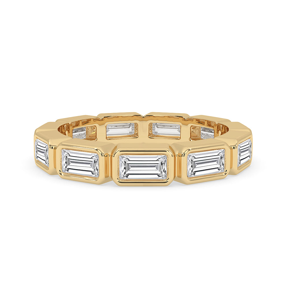 Bezel Set Diamond Band crafted in yellow gold band with a modern east to west band layout.
