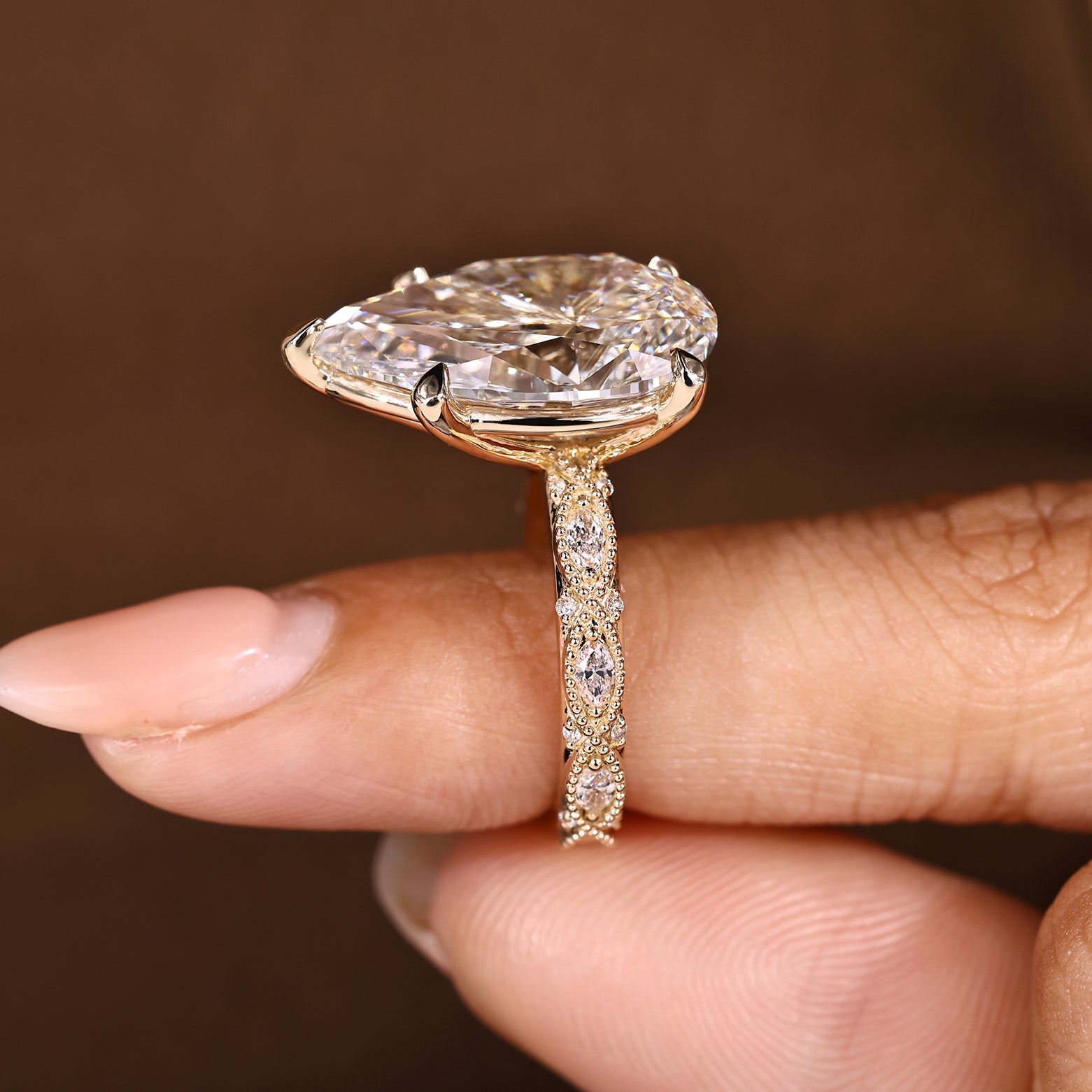 10 Carat Pear Shaped Diamond Ring with Marquise and Round Pave