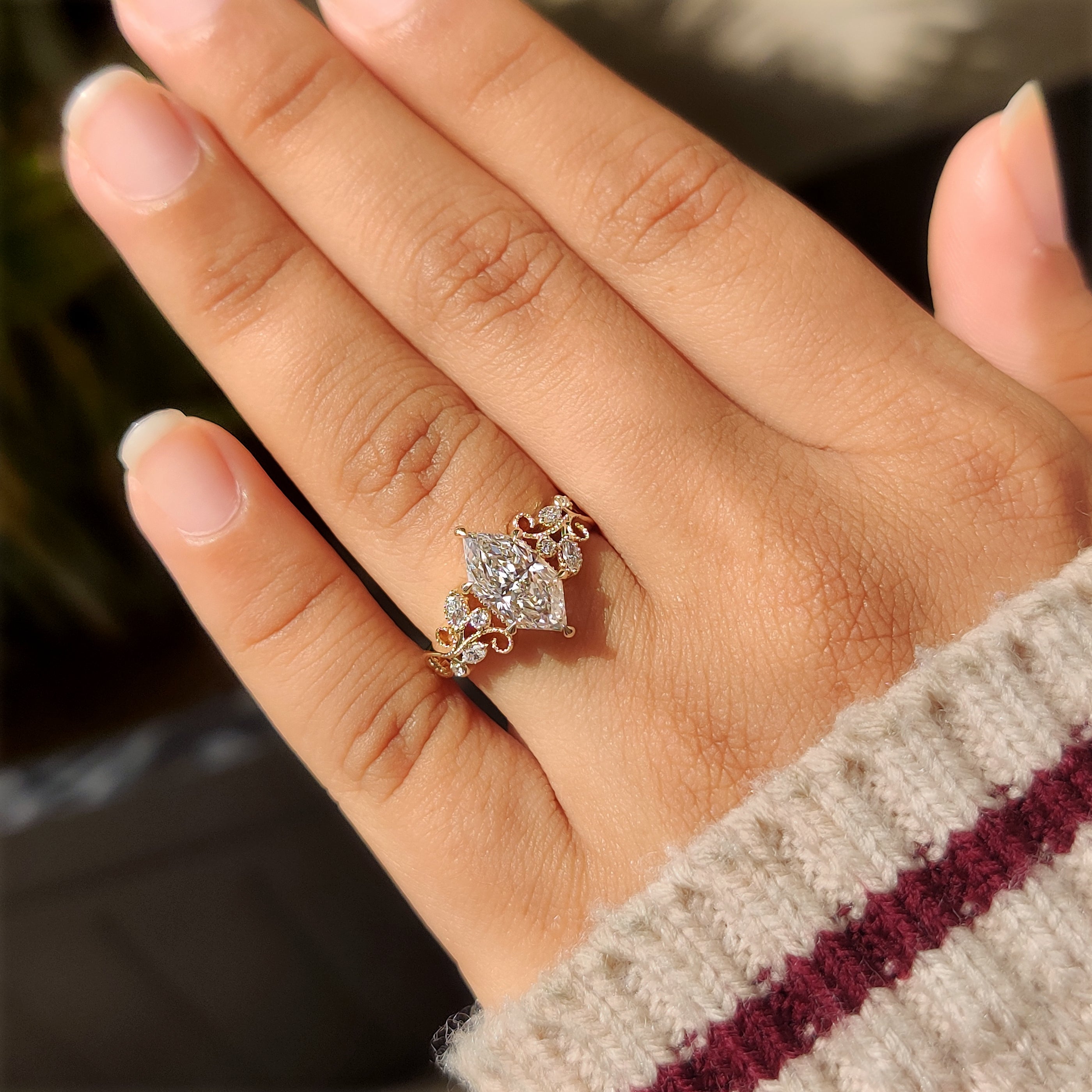 Dutch marquise center diamond with four claw prong setting
