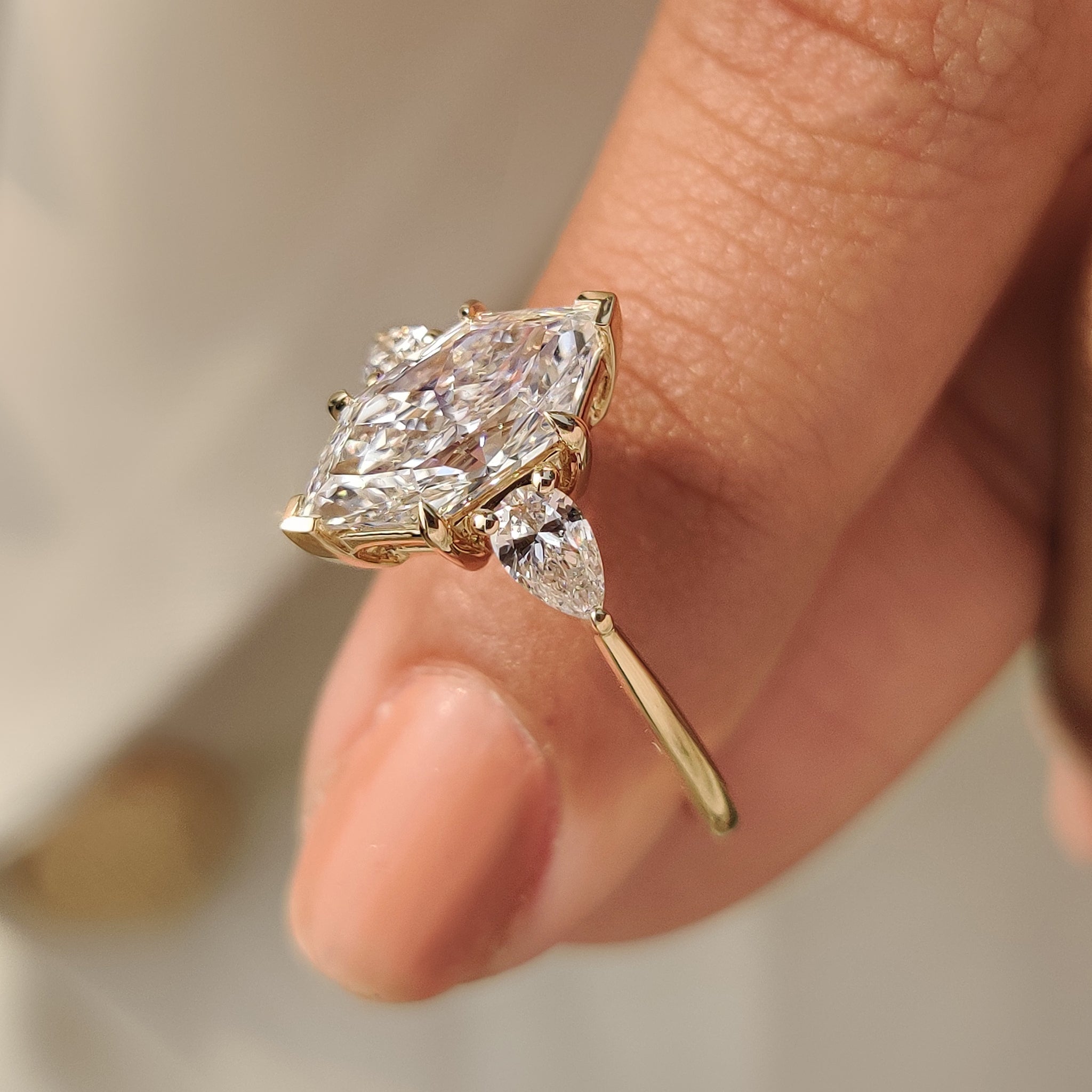 Dutch marquise diamond ring with pear side accents
