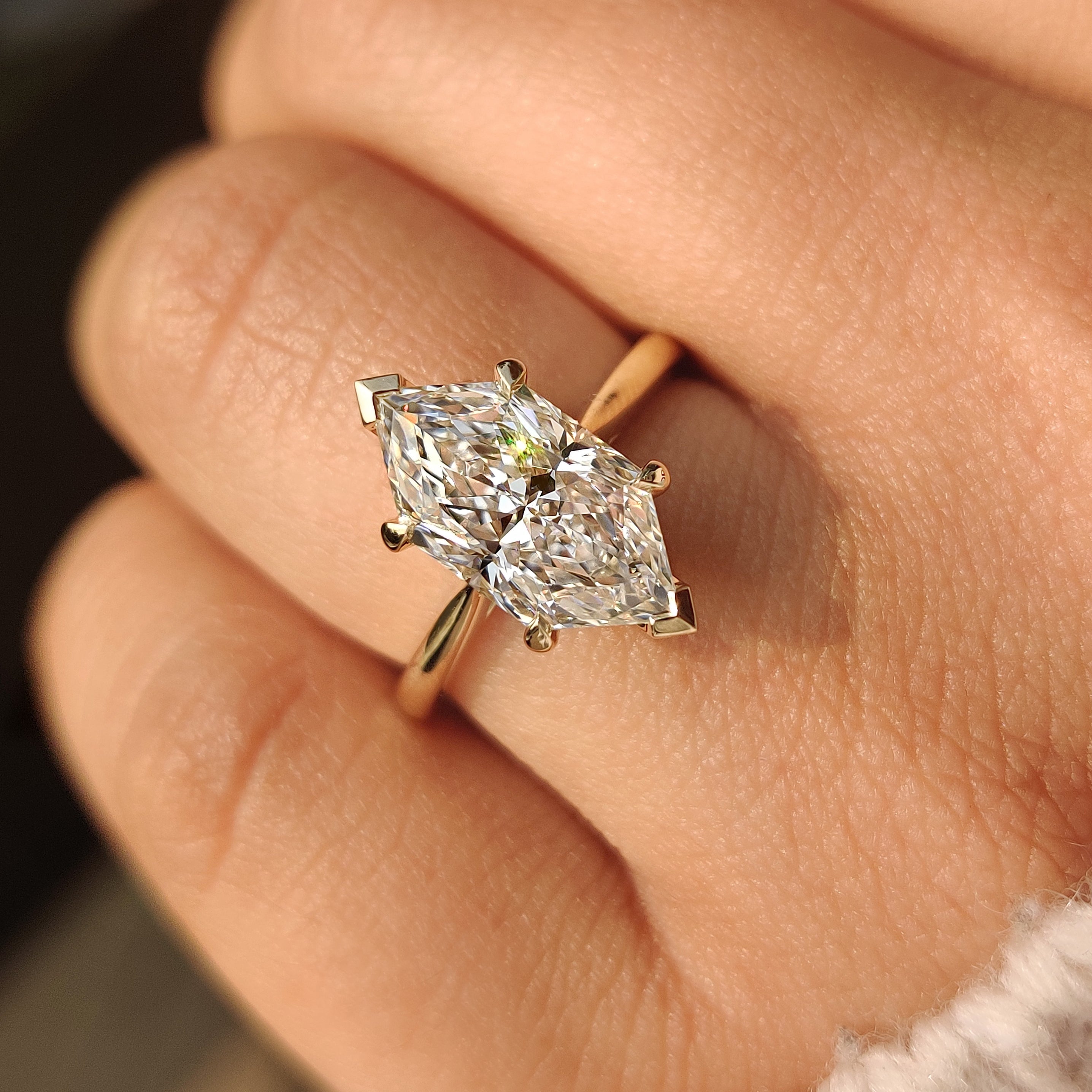 Dutch marquise solitaire ring with tapered shank and claws.
