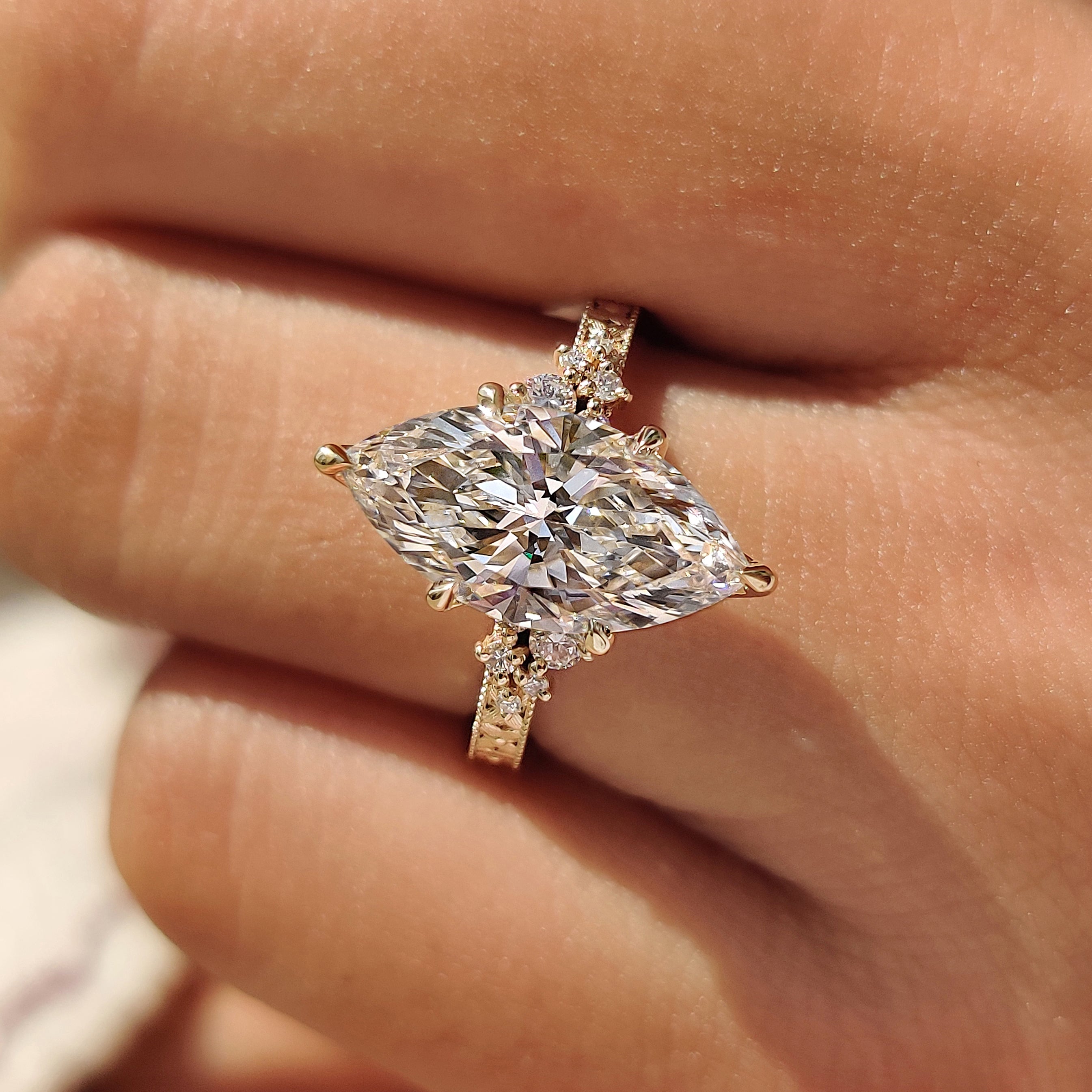 Marquise diamond ring with vintage inspired filigree design
