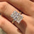 Radiant engagement ring with round hidden halo.
