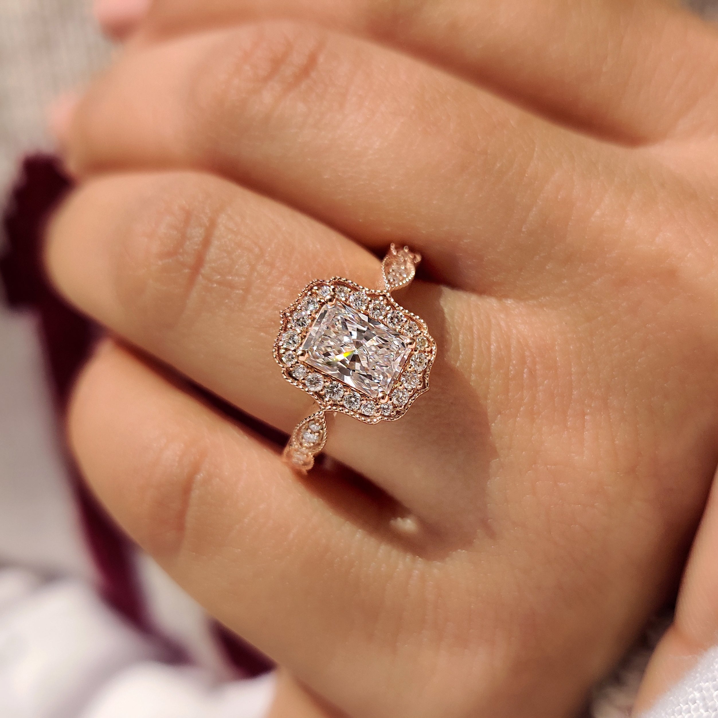Radiant diamond ring with four prong vintage setting.
