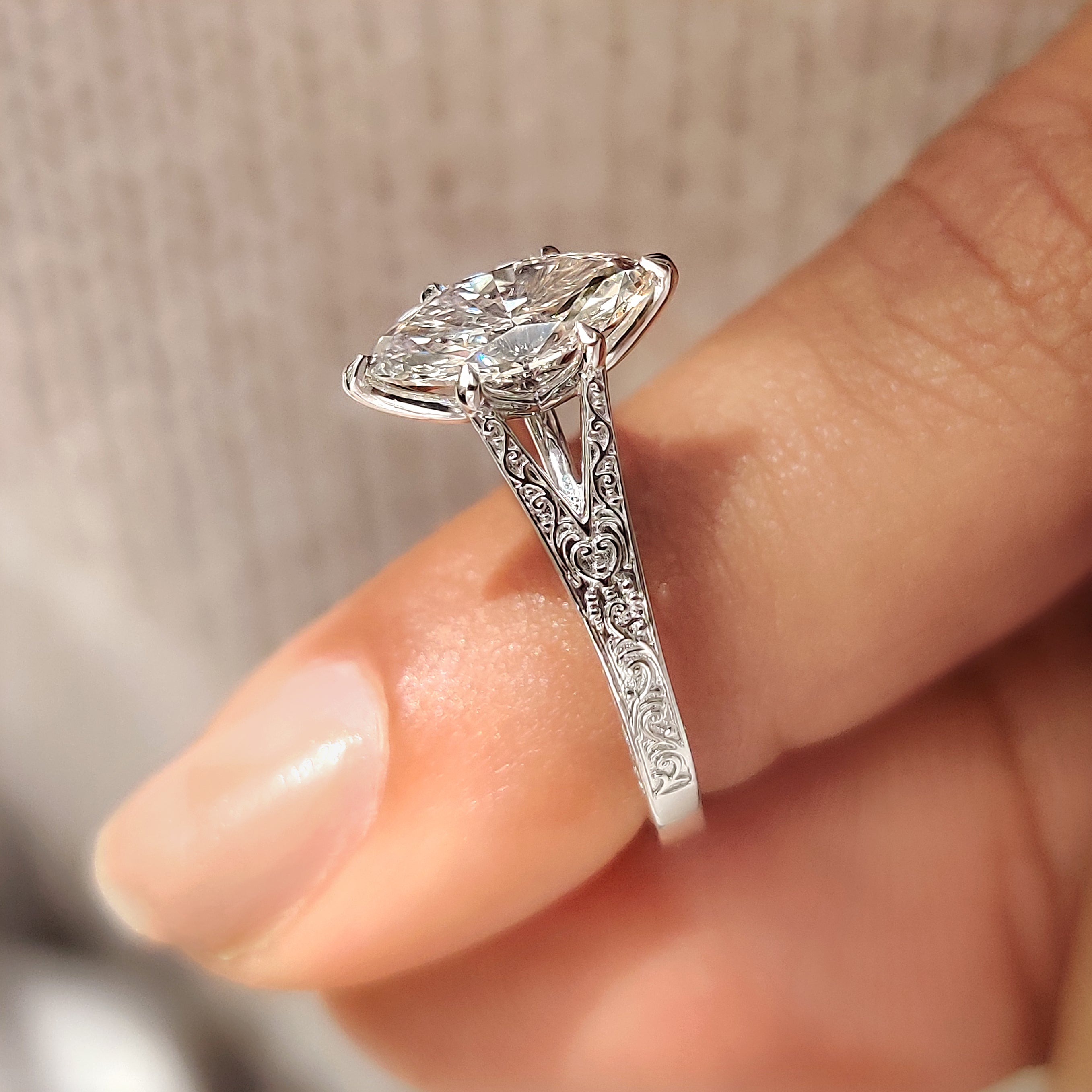 Fillgree marquise engagement ring with six claw prongs.
