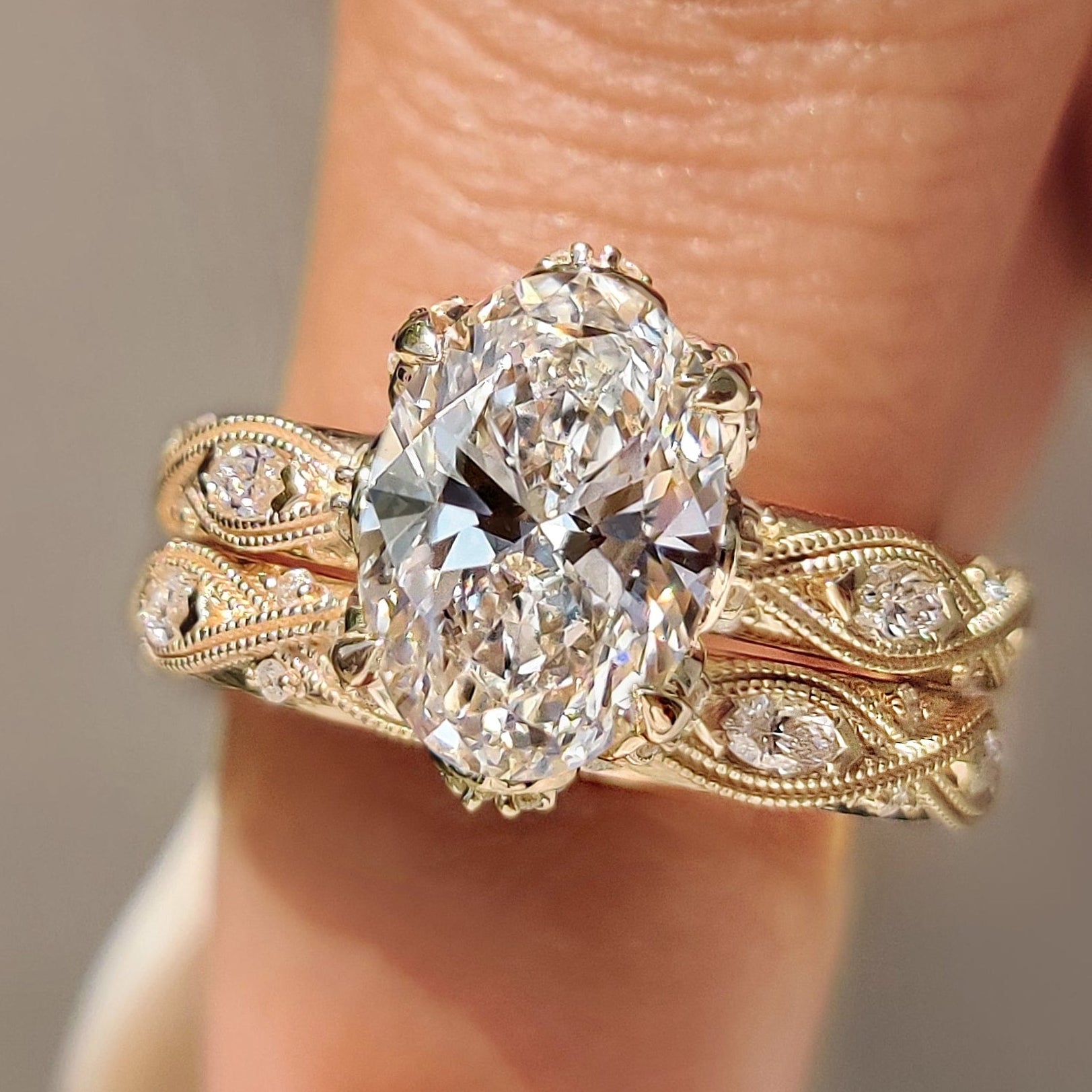 Vintage bridal set with oval cut ring and marquise side stones.
