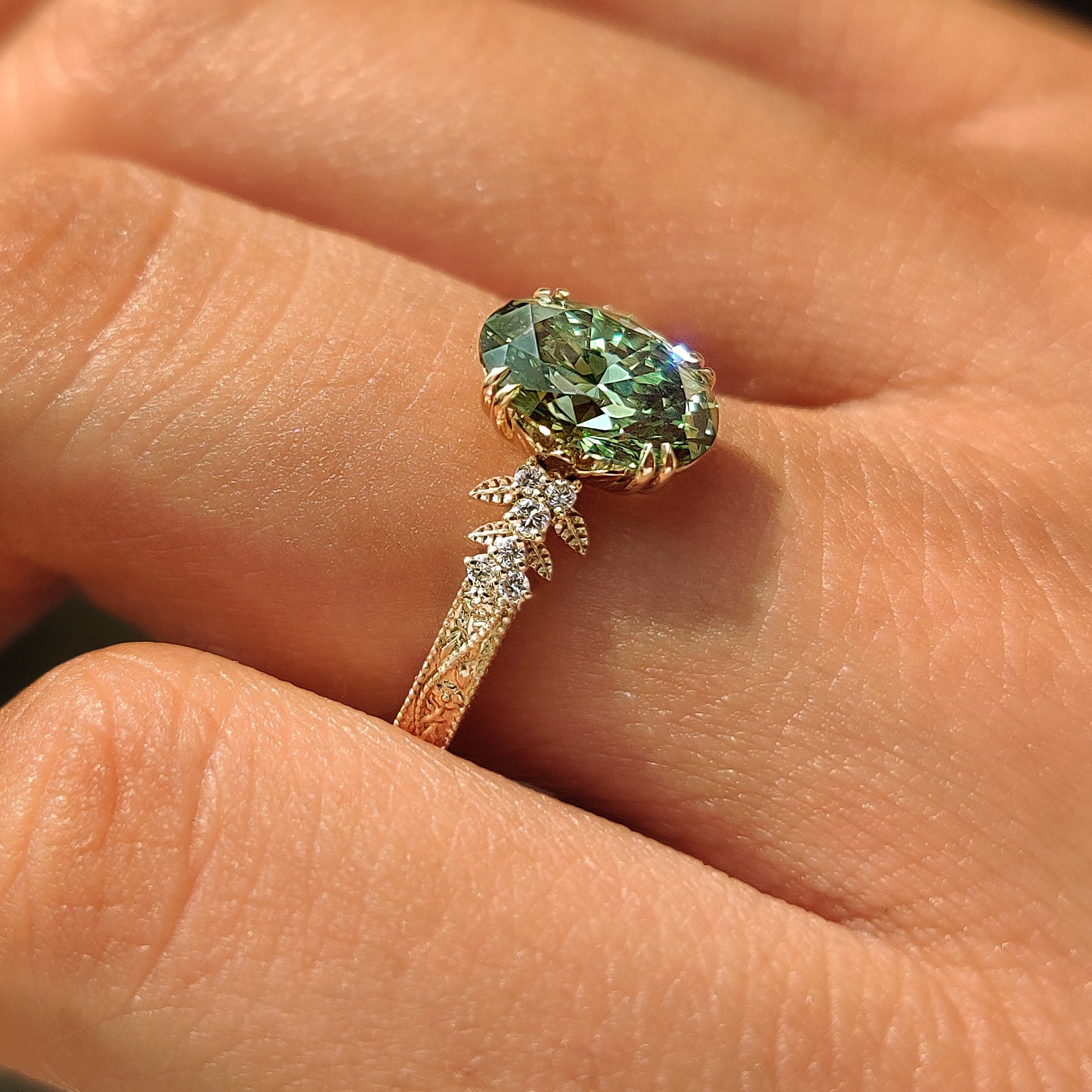 Handmade green oval lab-grown diamond ring by Carat Diamonds.