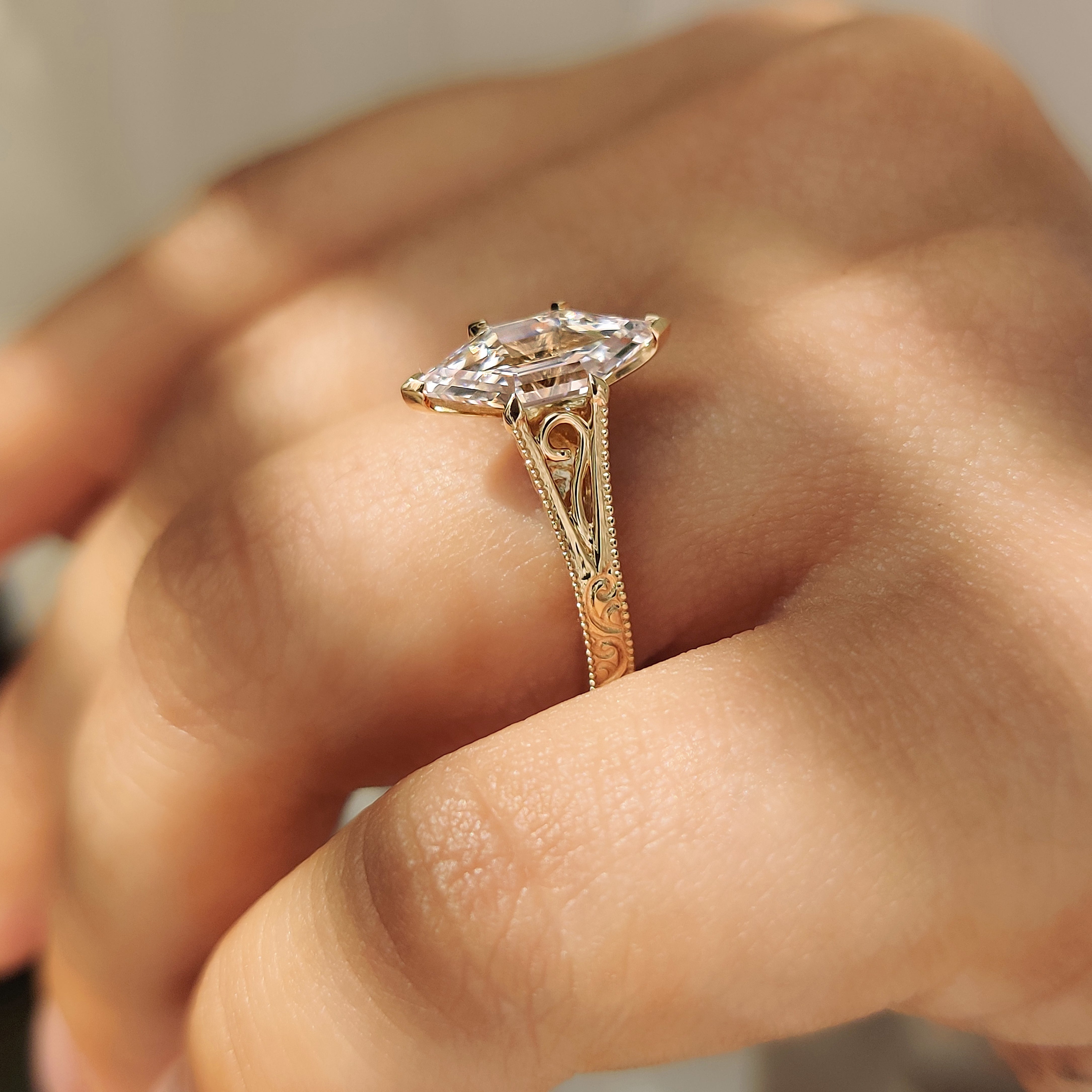 Solitaire hexagon diamond ring with vintage inspired milgrain details
