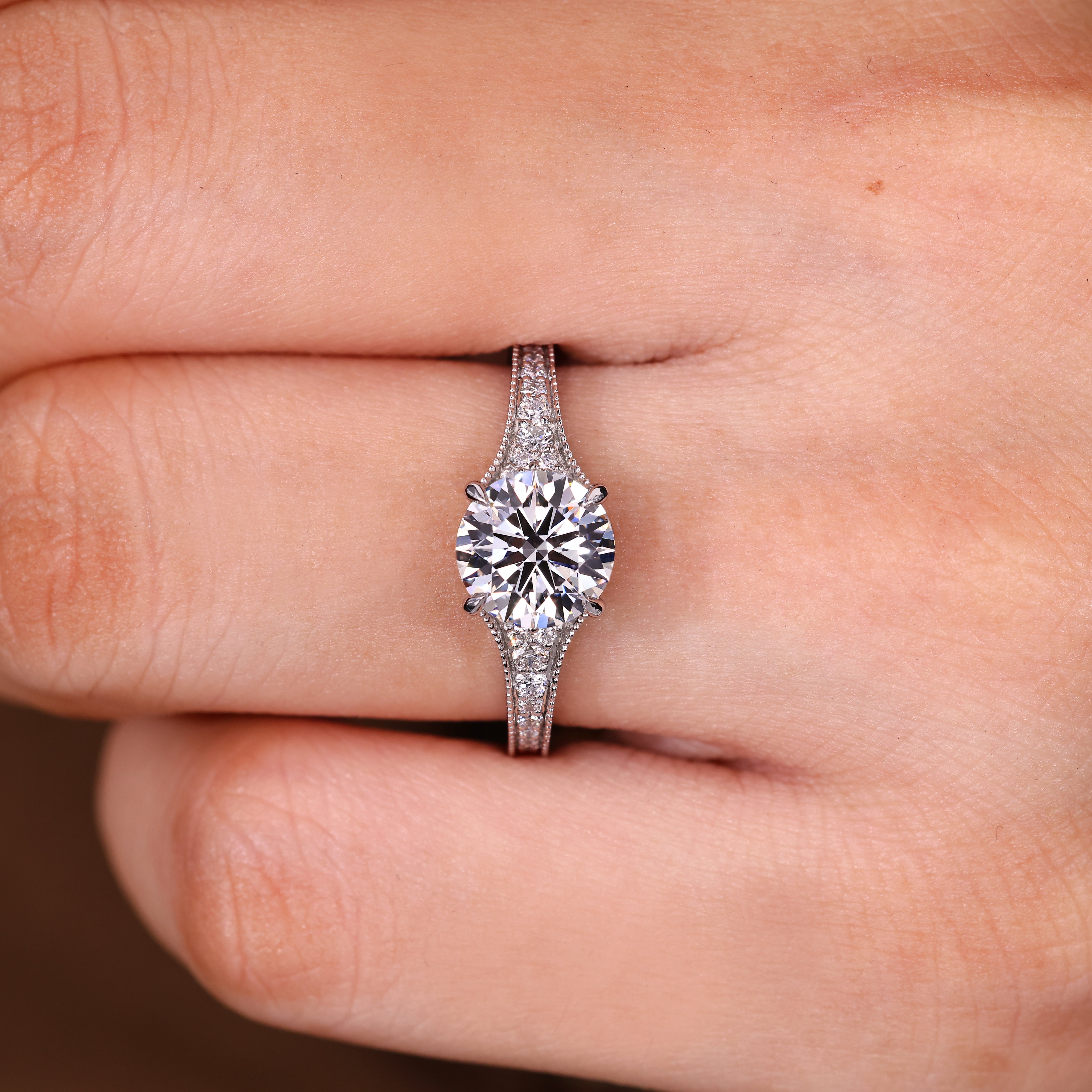 Round diamond ring with four claw prong setting
