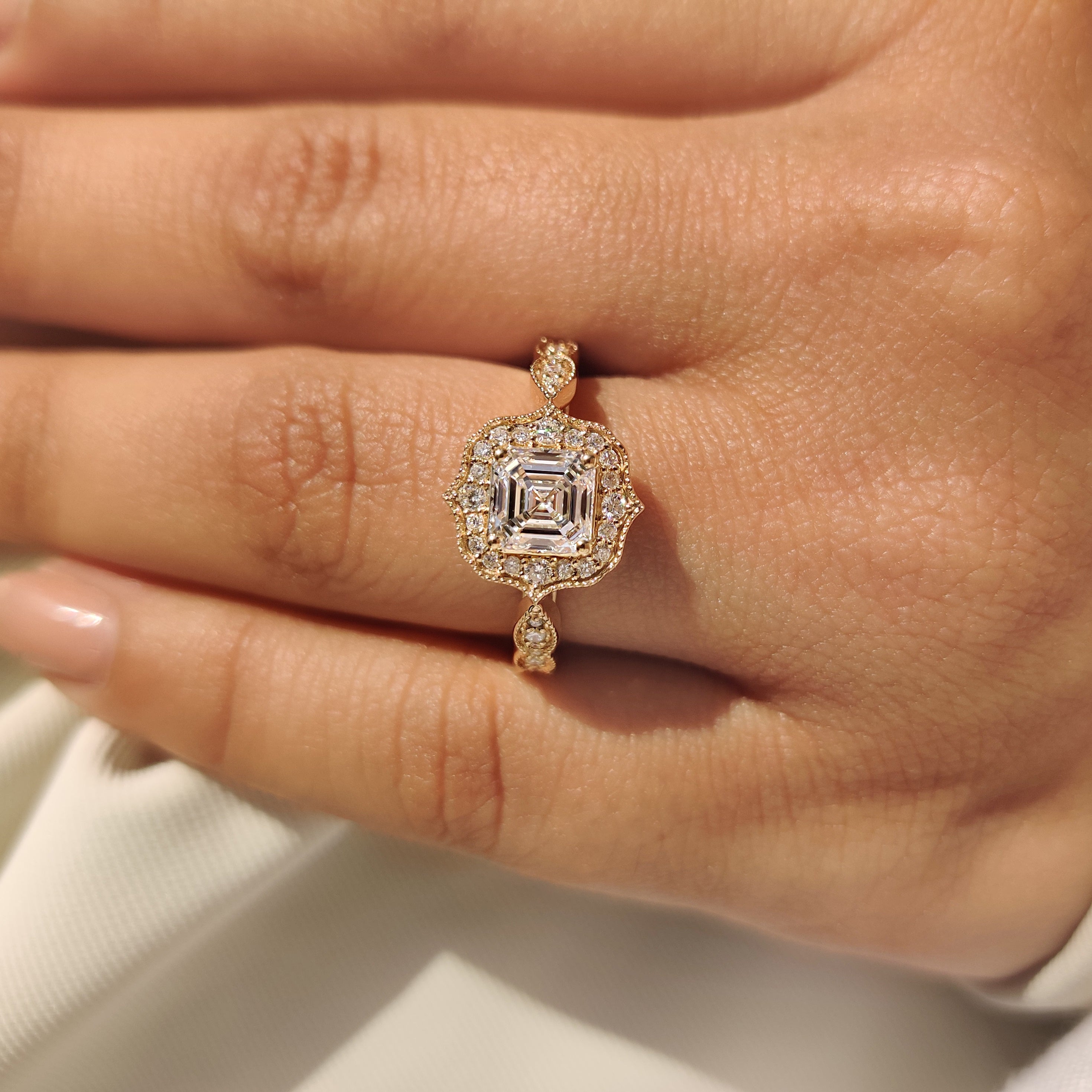 Lab grown Asscher diamond ring with pave band detailing.

