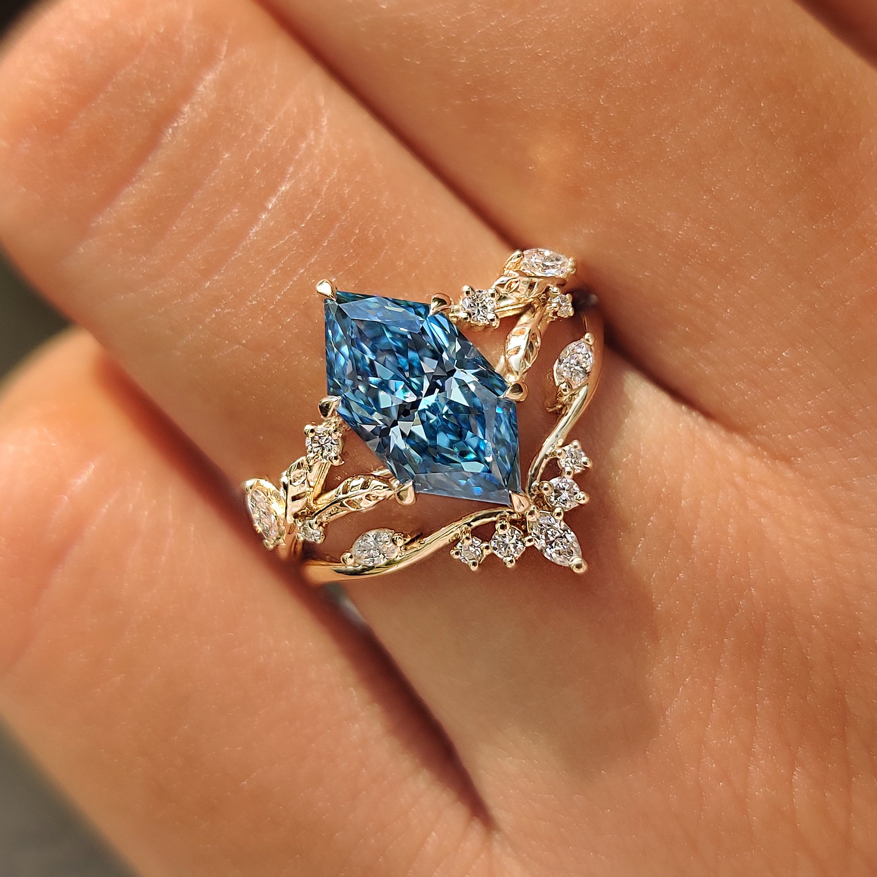 Blue Dutch marquise ring set with stackable curved diamond band.
