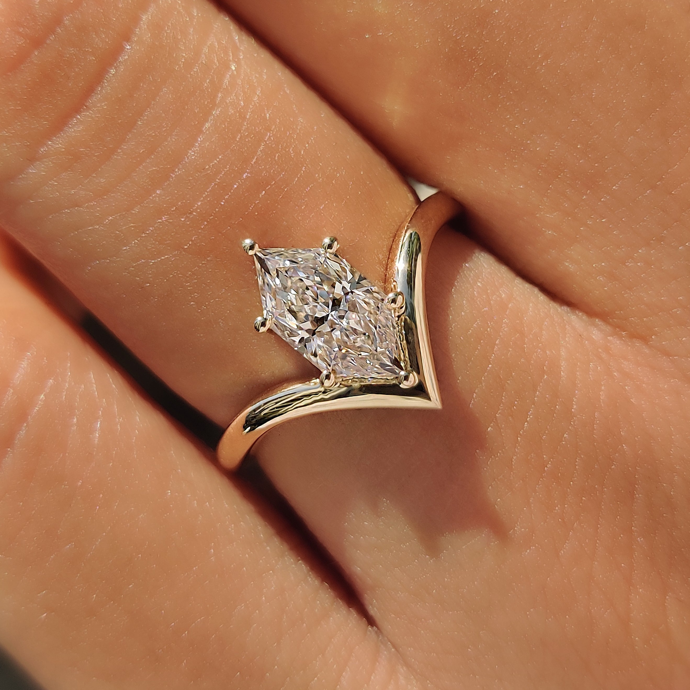 Dutch marquise center diamond in a yellow gold solitaire setting.

