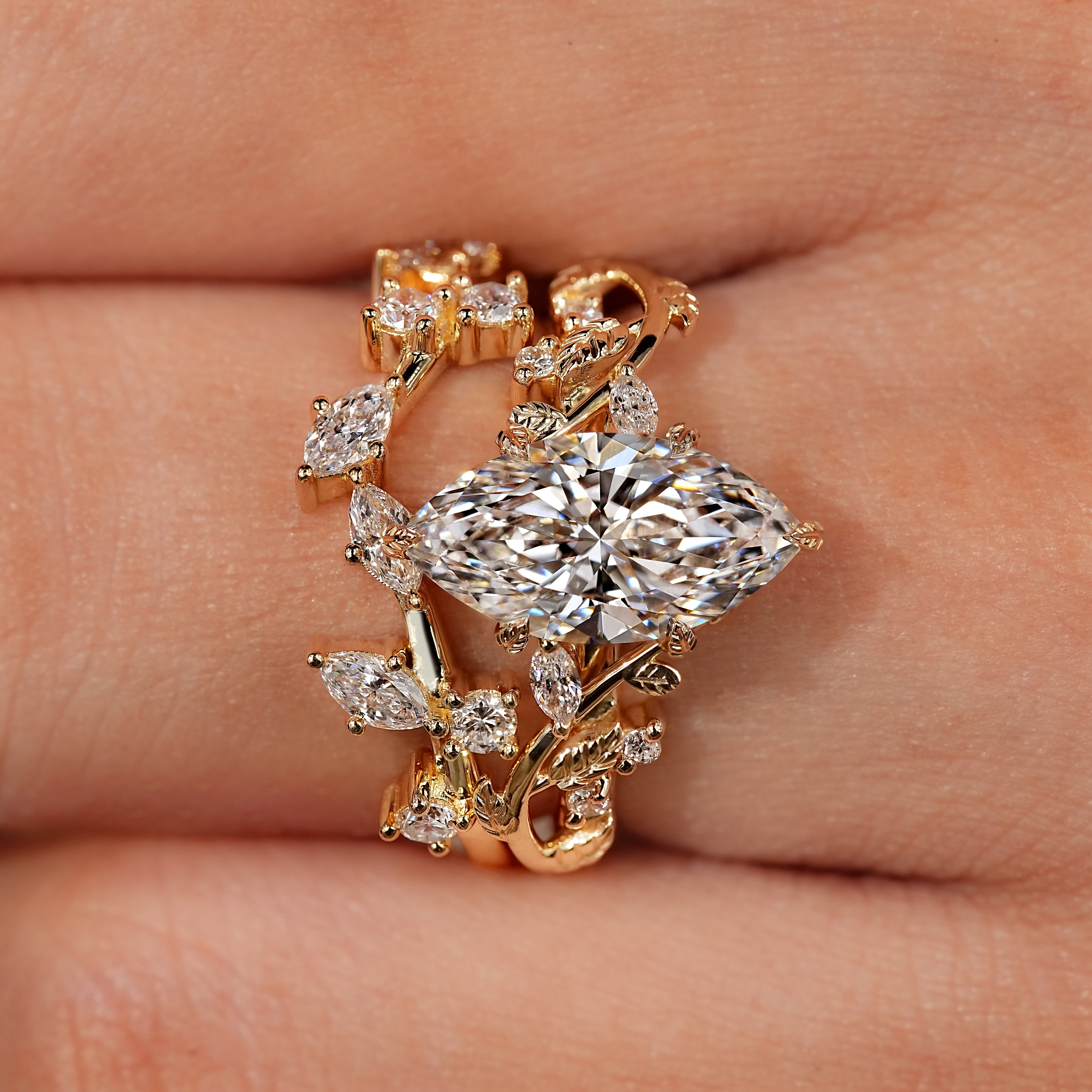 Yellow gold matching bridal set with botanical ring details.
