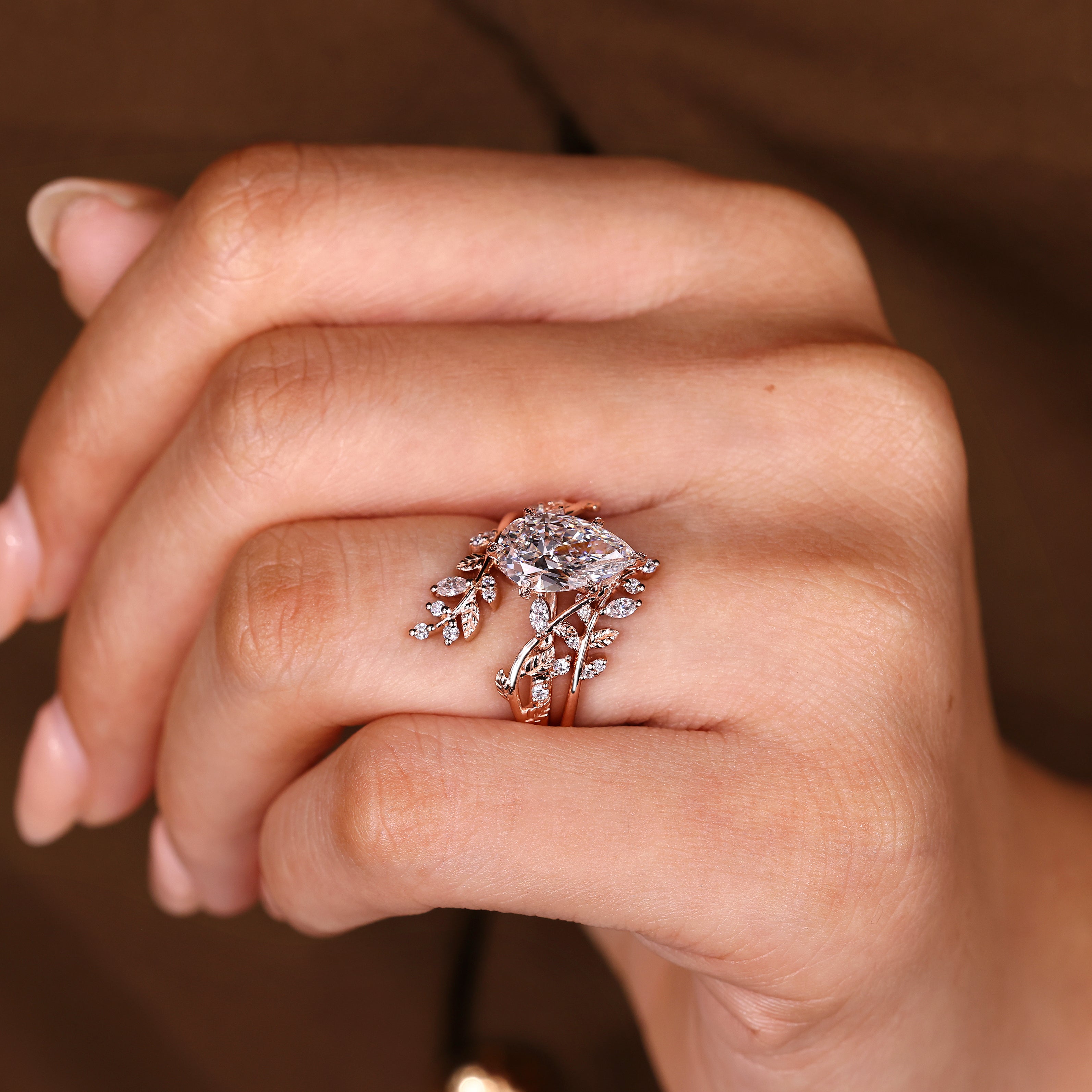 Handmade pear diamond ring with marquise accent side stones
