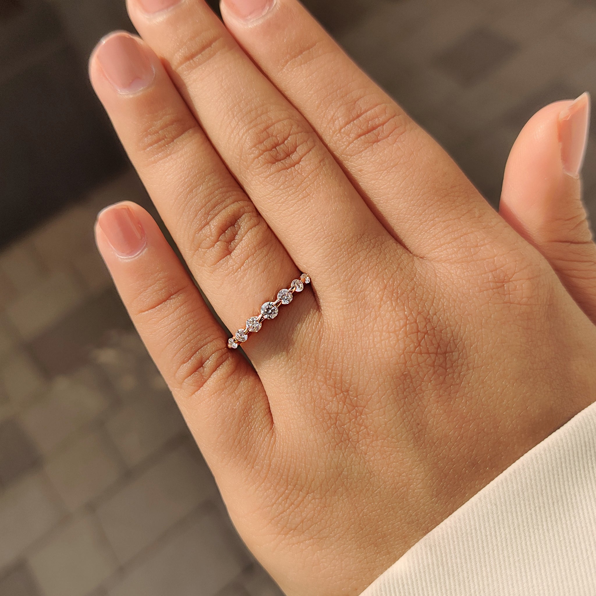 Round diamond wedding band with seven stone arrangement.
