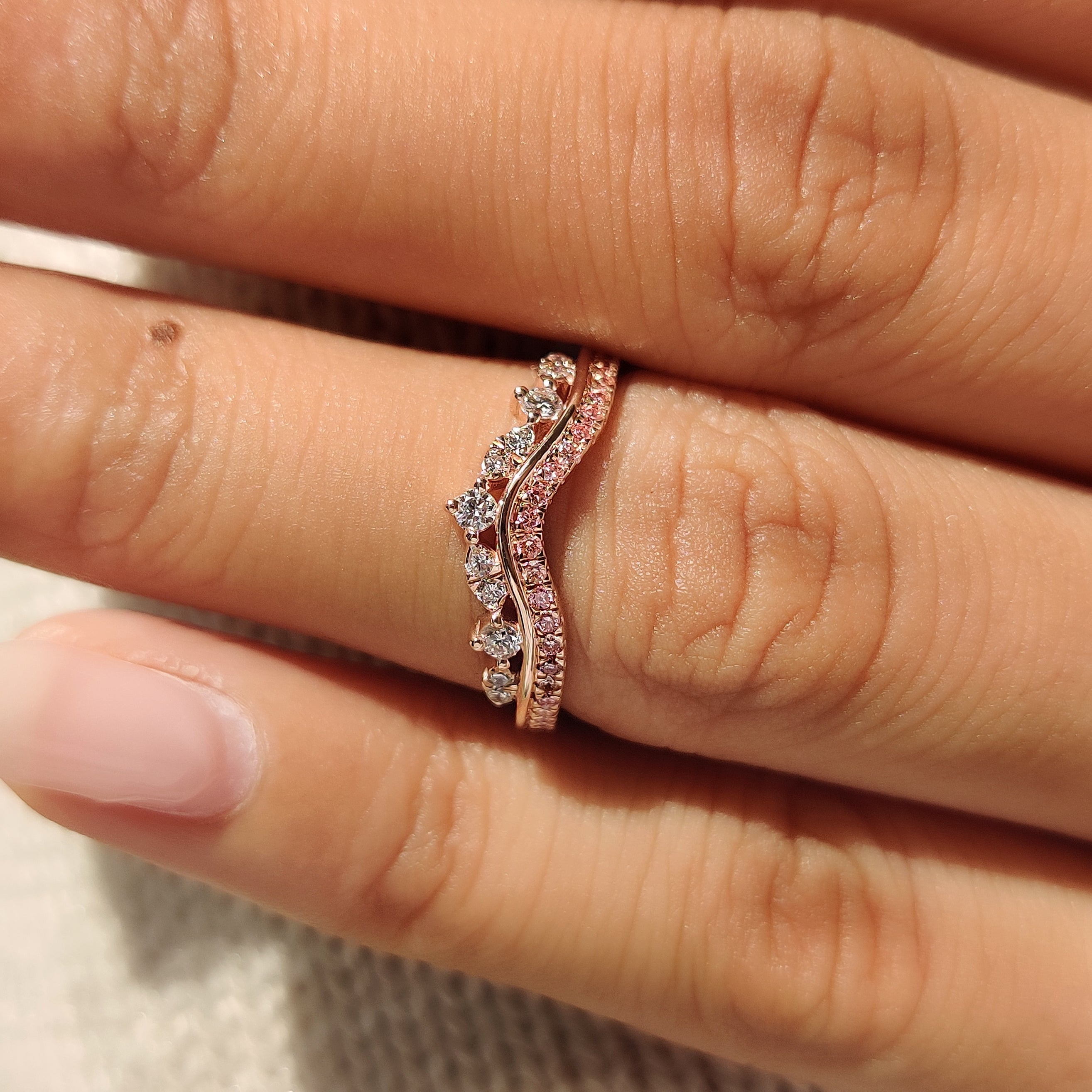 Handmade tiara wedding band with shared prong diamond setting
