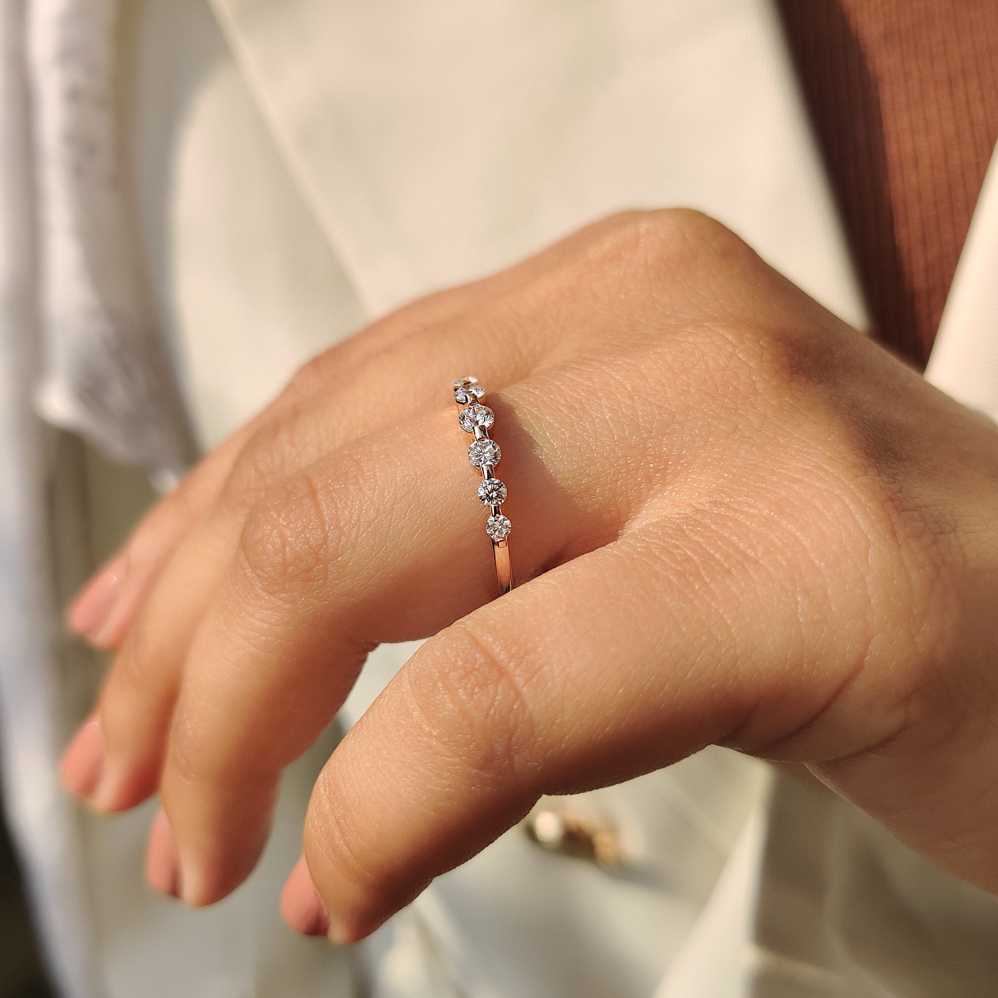 Half eternity round diamond band with handmade shared prongs.
