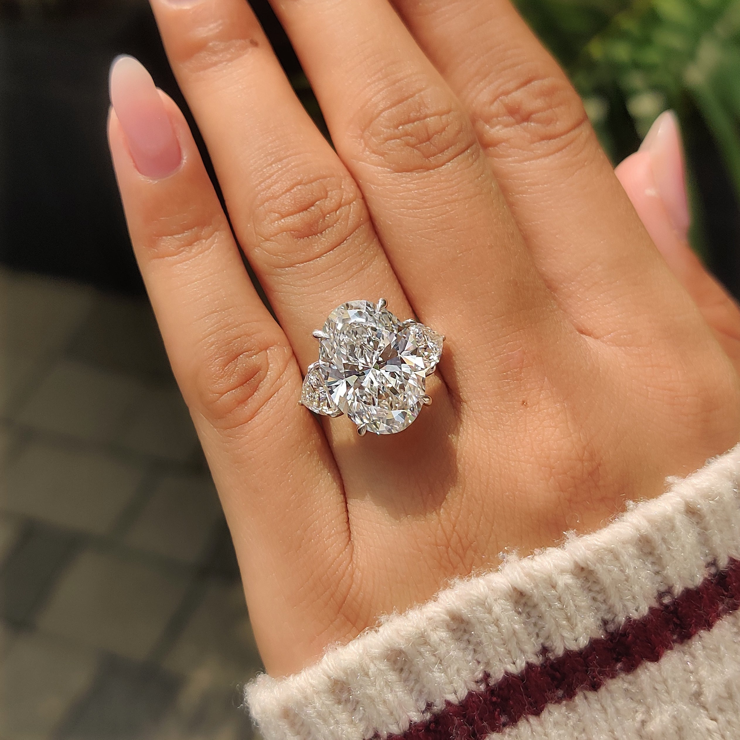 Three stone oval diamond ring in cathedral style
