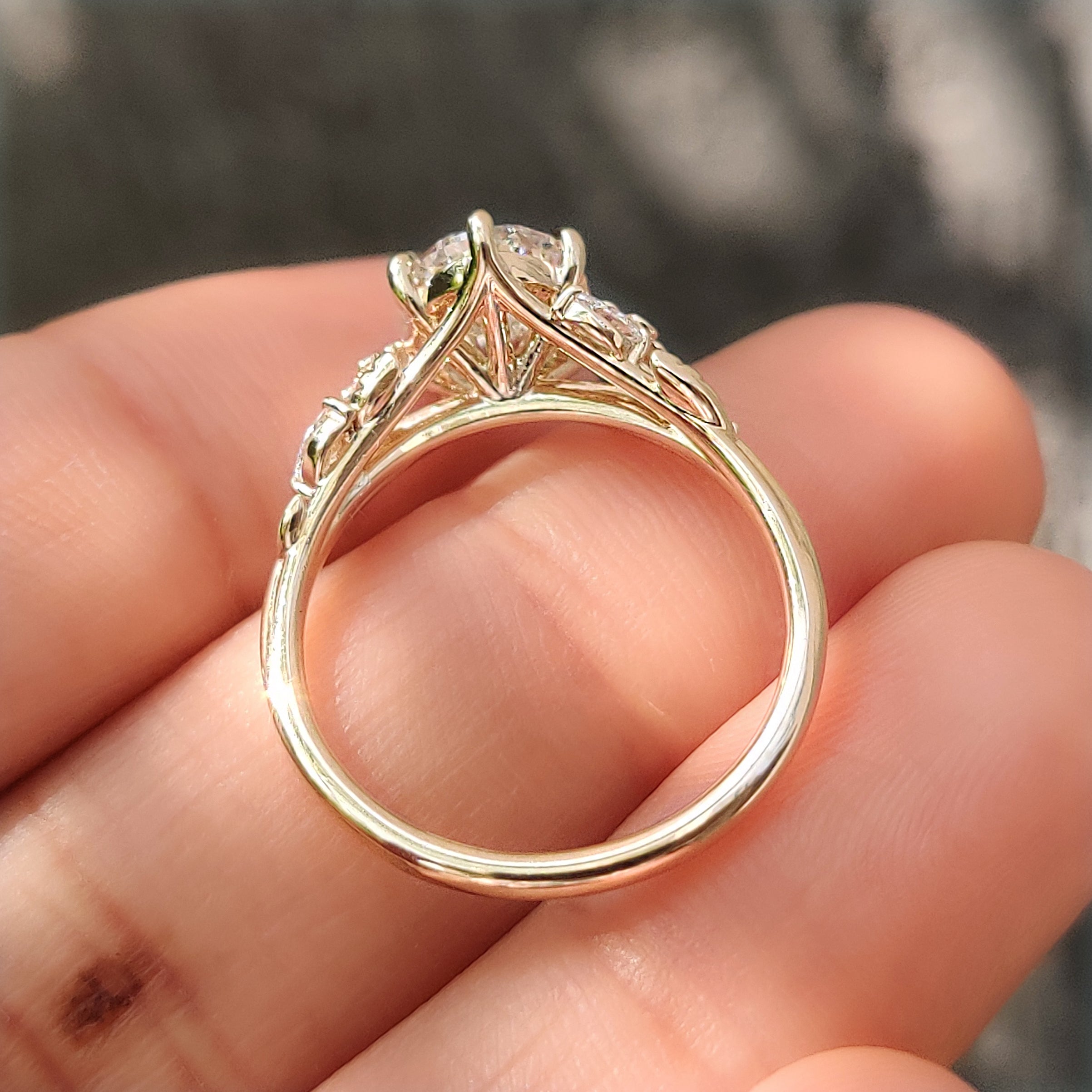 Six claw prong setting securing an oval cut diamond ring.
