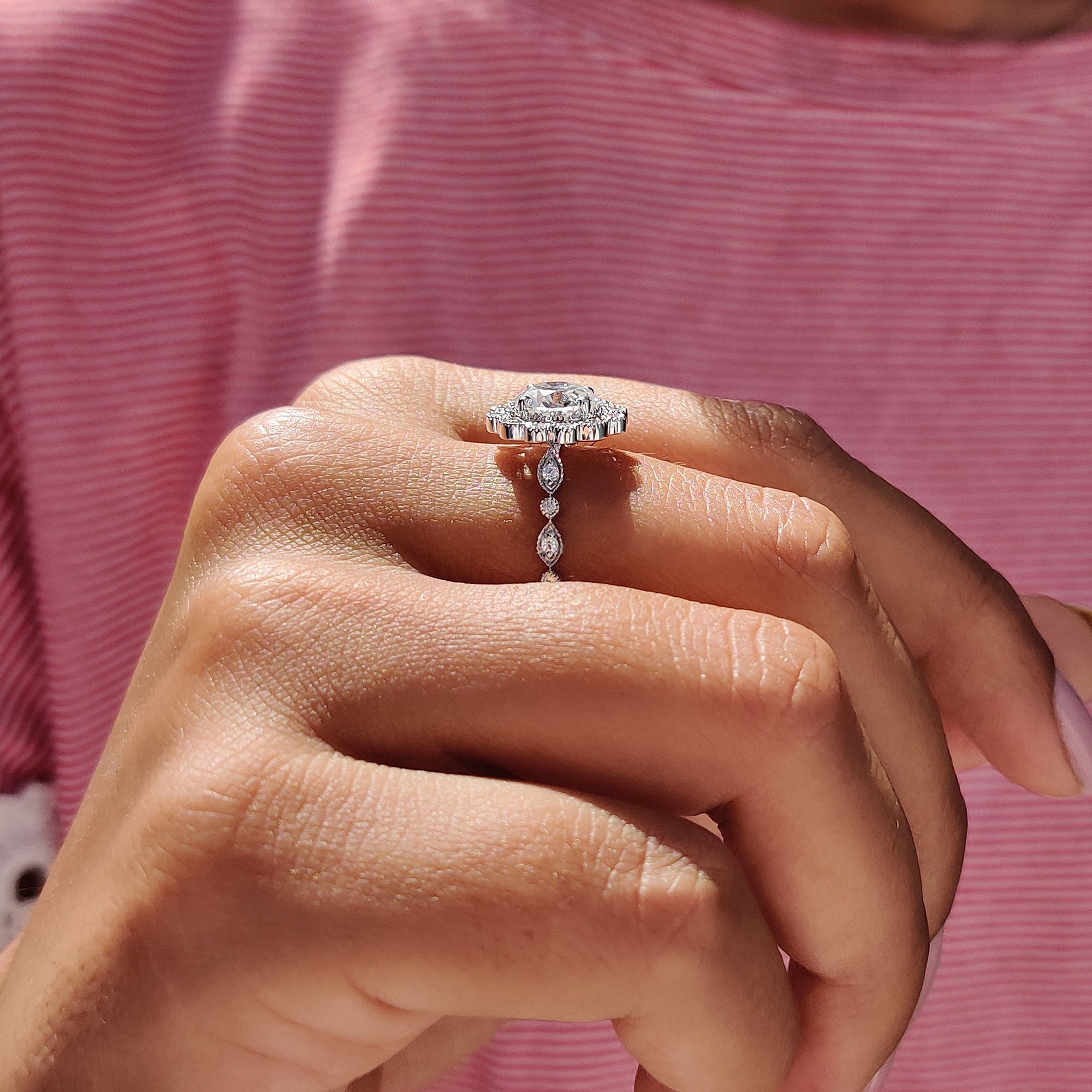 Vintage moissanite ring with intricate detailing.
