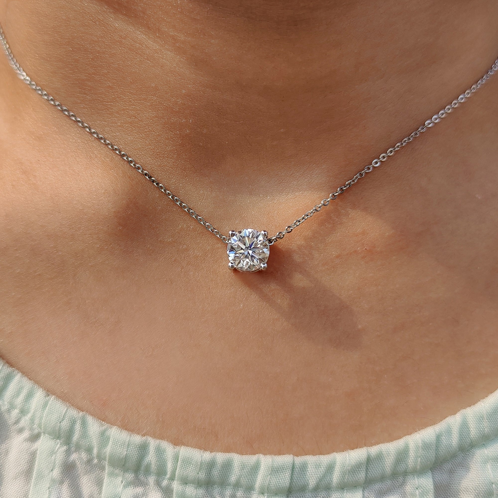 Solitaire Wedding Pendant featured in round Cut pendant and moissanite pendant designs.
