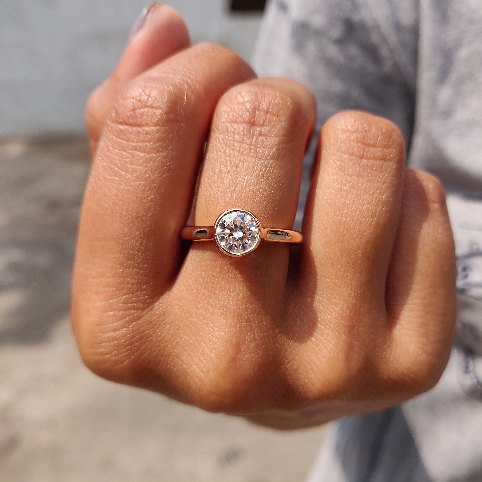 Carat Diamonds engagement ring with round center.