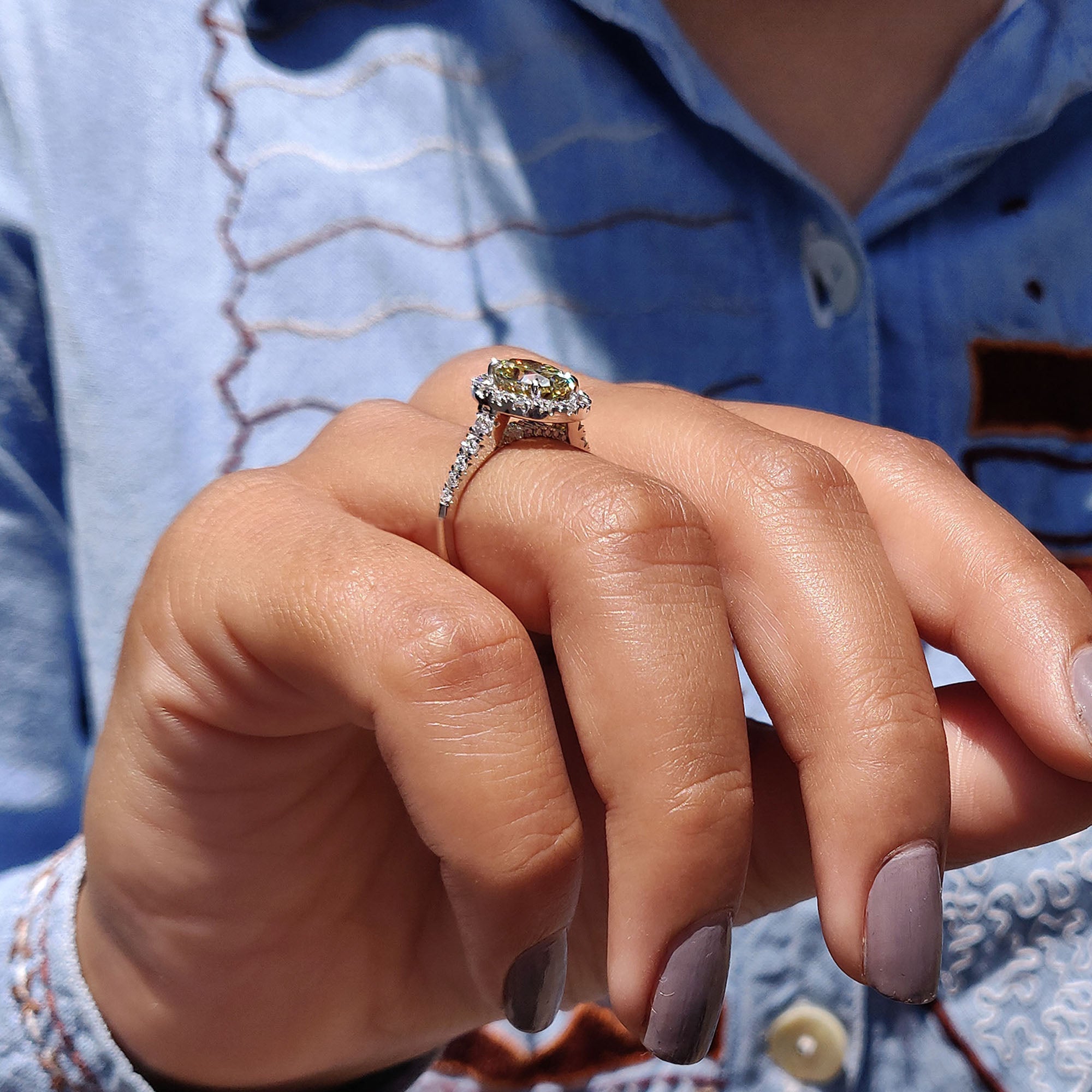 Oval cut moissanite ring in a custom micro pave setting.