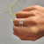 The bezel setting ring features a sleek design.
