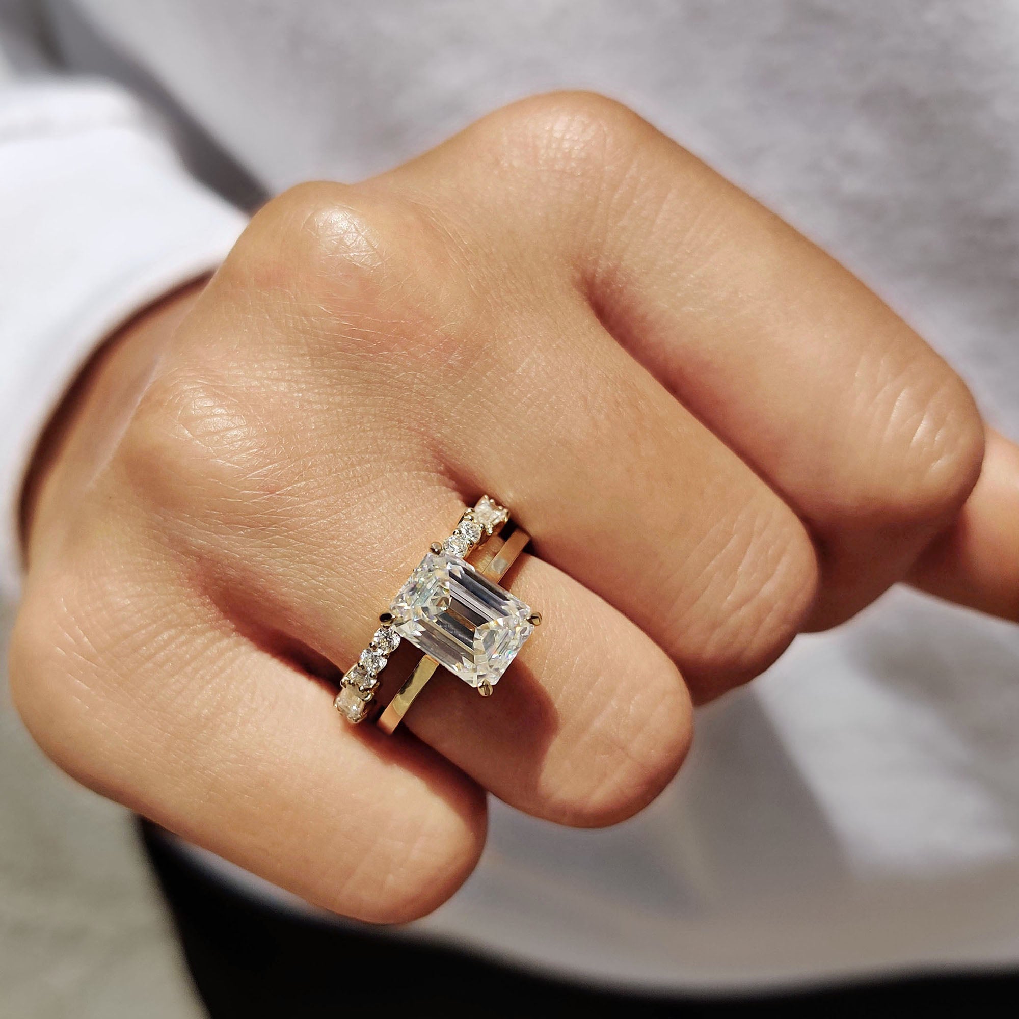 Baguette and round wedding band with a hidden halo engagement ring.
