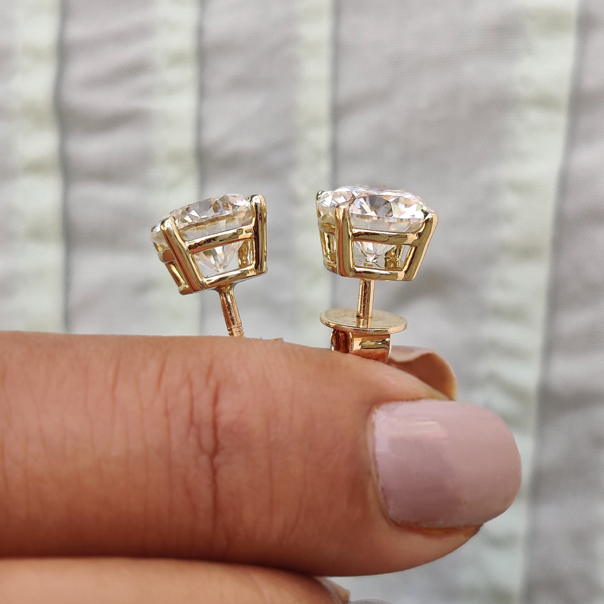 Moissanite Stud Earrings crafted with 4 claw prong setting in yellow gold earrings style.
