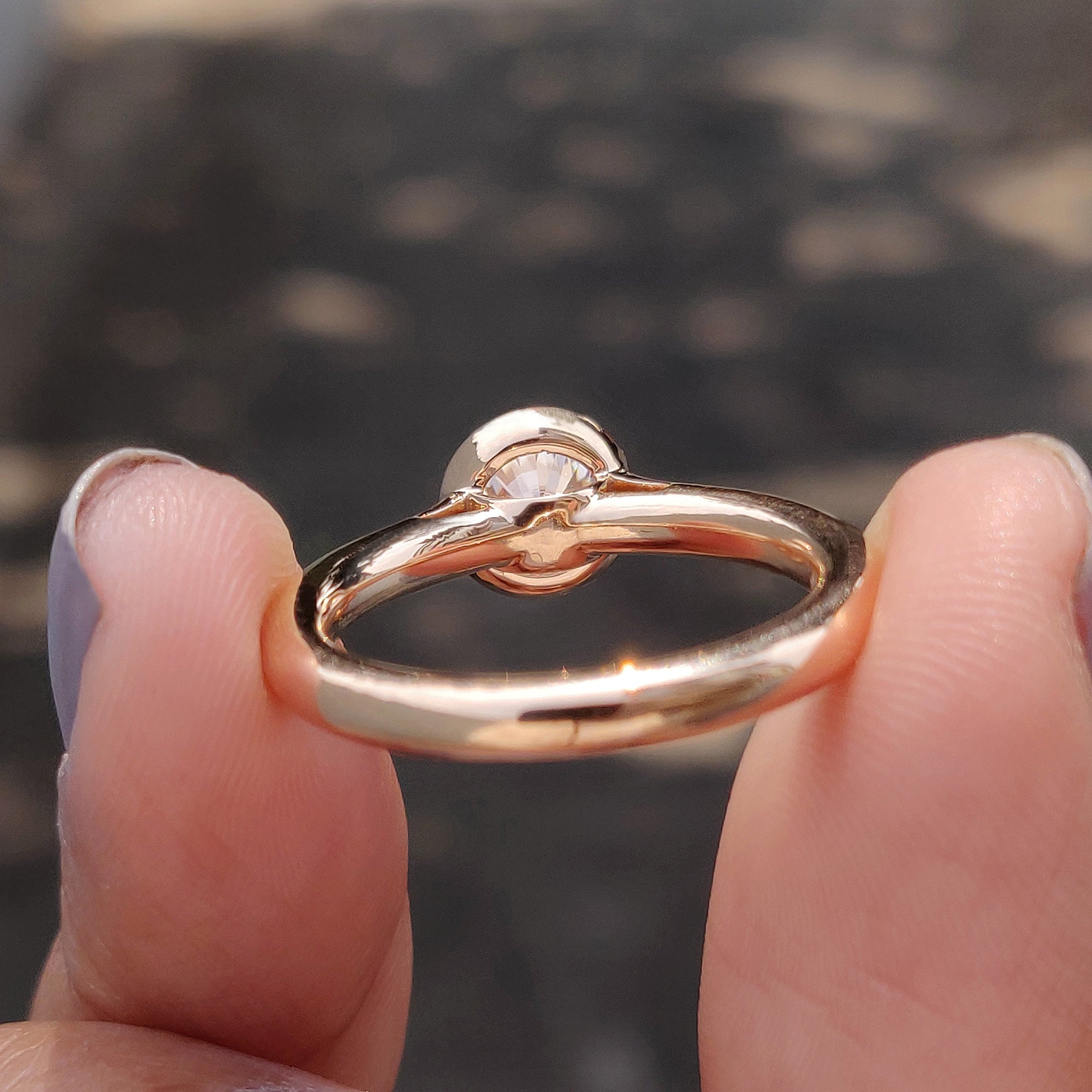 Solitaire ring with custom round moissanite.