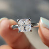 Cushion cut engagement ring in white gold.

