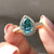This pear cut moissanite ring offers unique shape and brilliant sparkle.