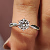 Round solitaire engagement ring with tapered shank ring.
