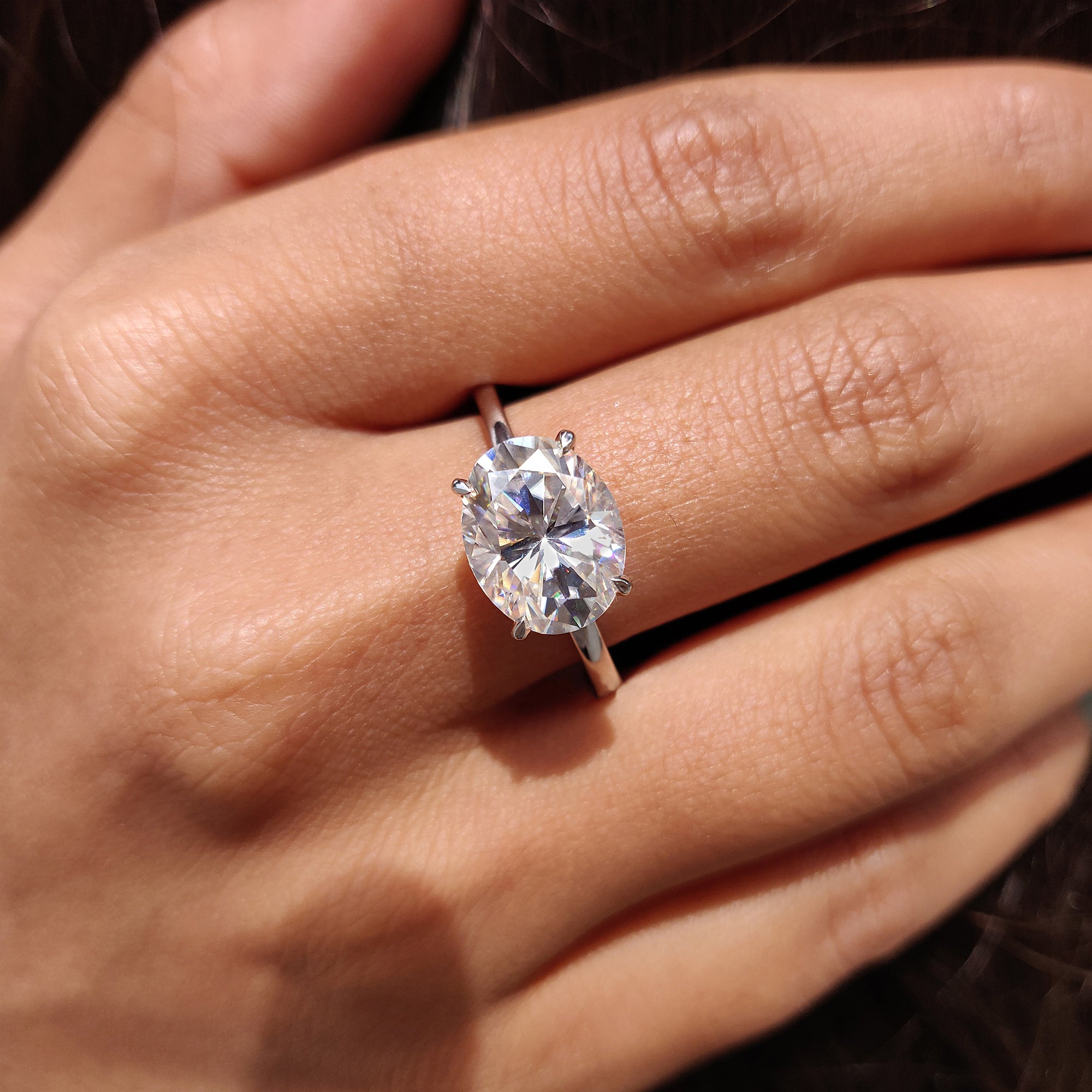 White gold engagement ring with a solitaire setting.