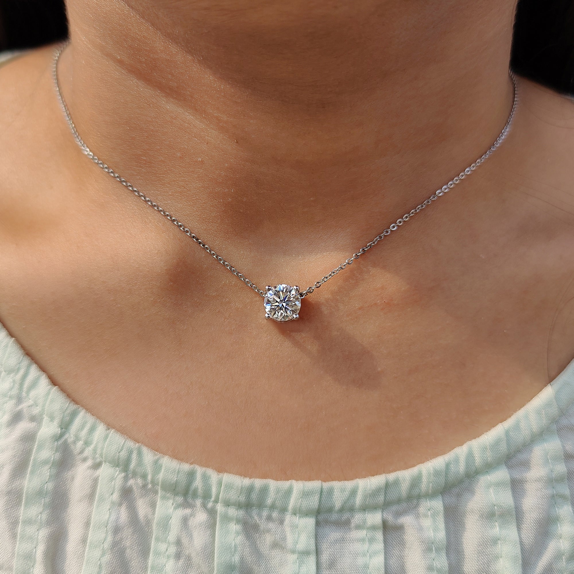 Round Cut pendant styled with a four prong set pendant setting for everyday wear.
