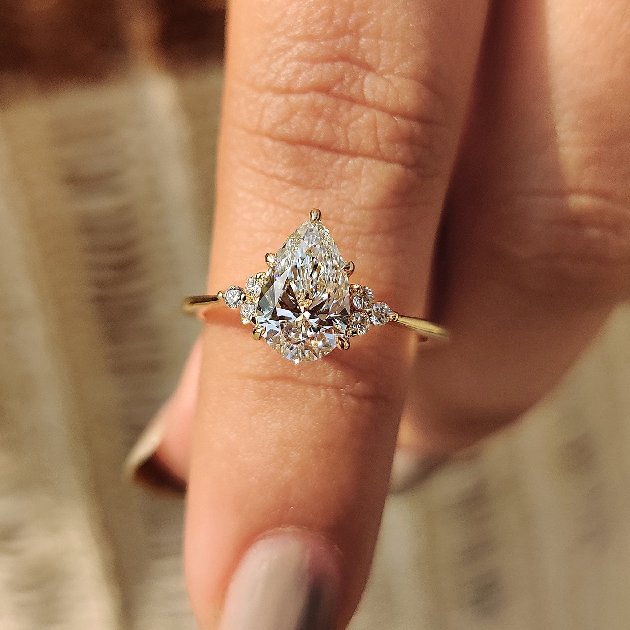 Pear cut engagement ring with a stunning design.
