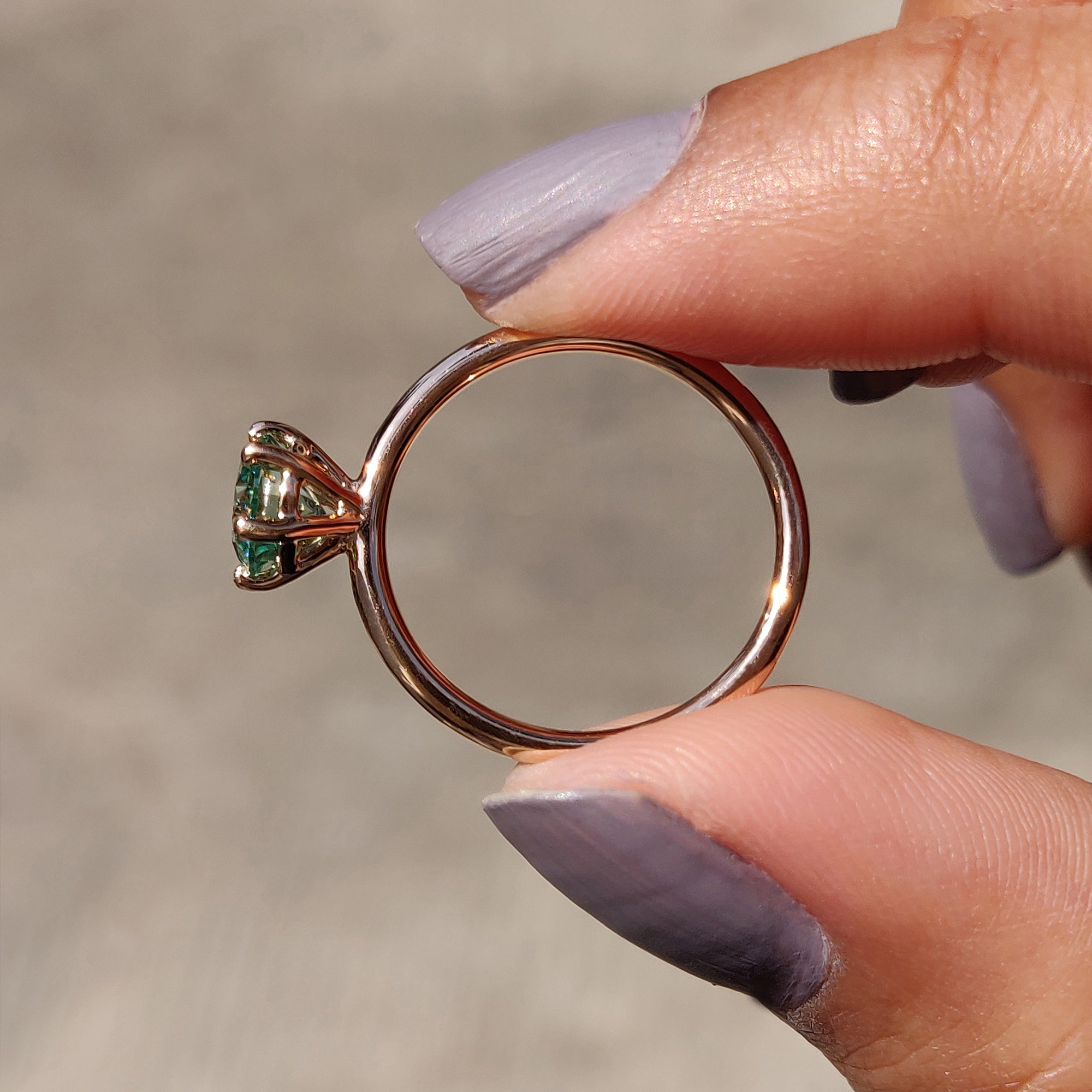 A round cut ring for her makes a perfect symbol of love.
