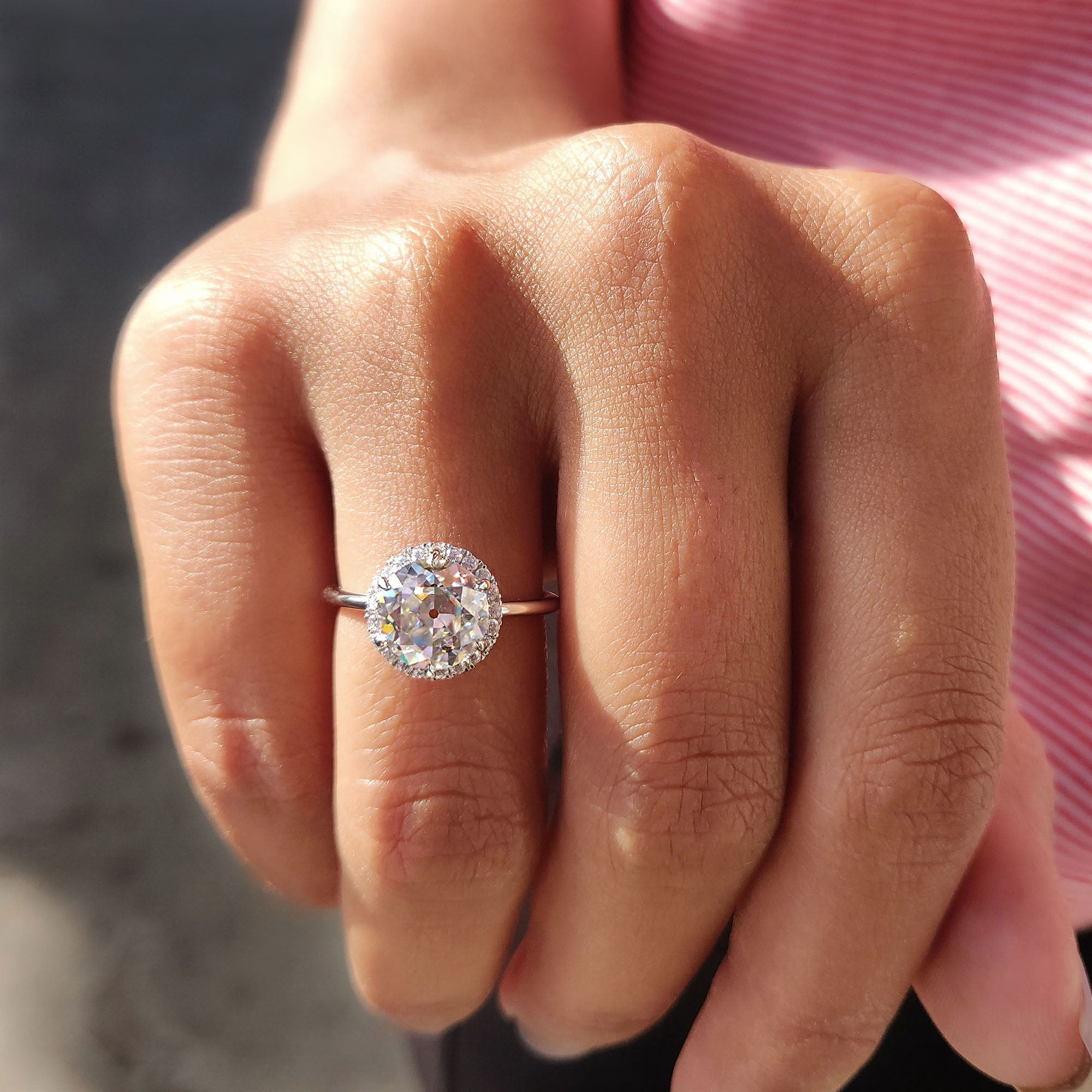A round cut halo hidden halo ring adds a touch of secret sparkle beneath the stone.
