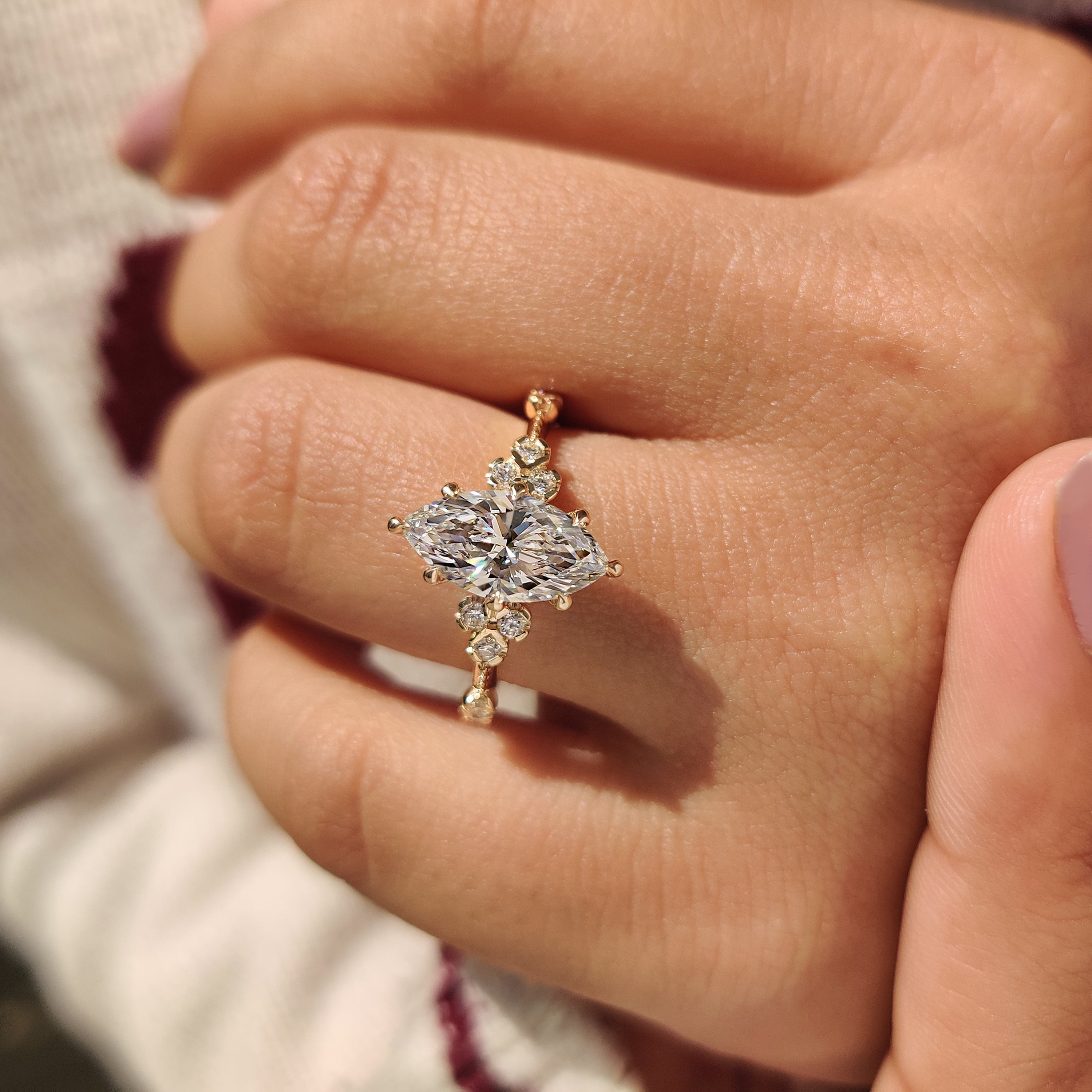 Marquise lab diamond ring with detailed milgrain vintage design.
