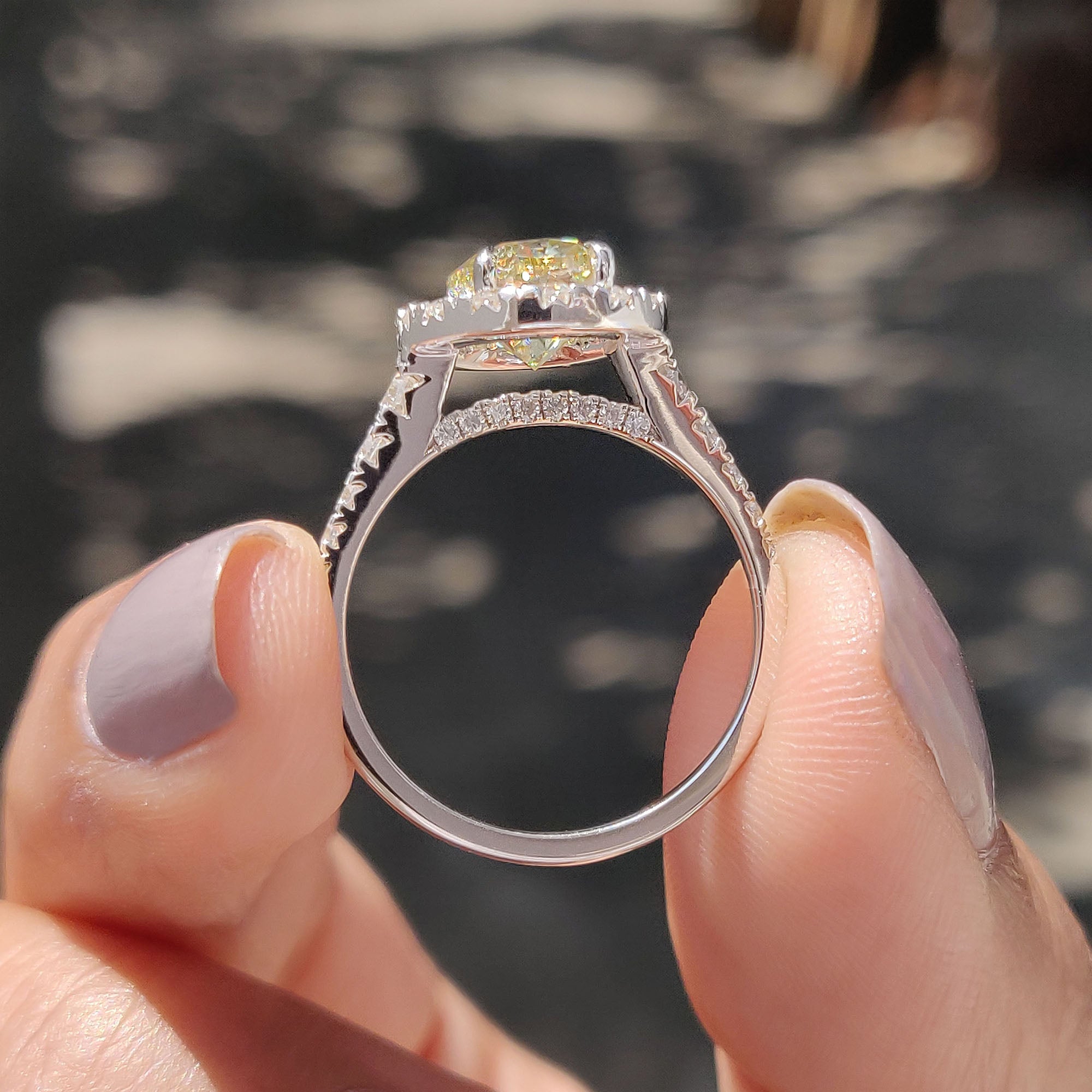 Round cut moissanite ring with a unique micro pave setting.