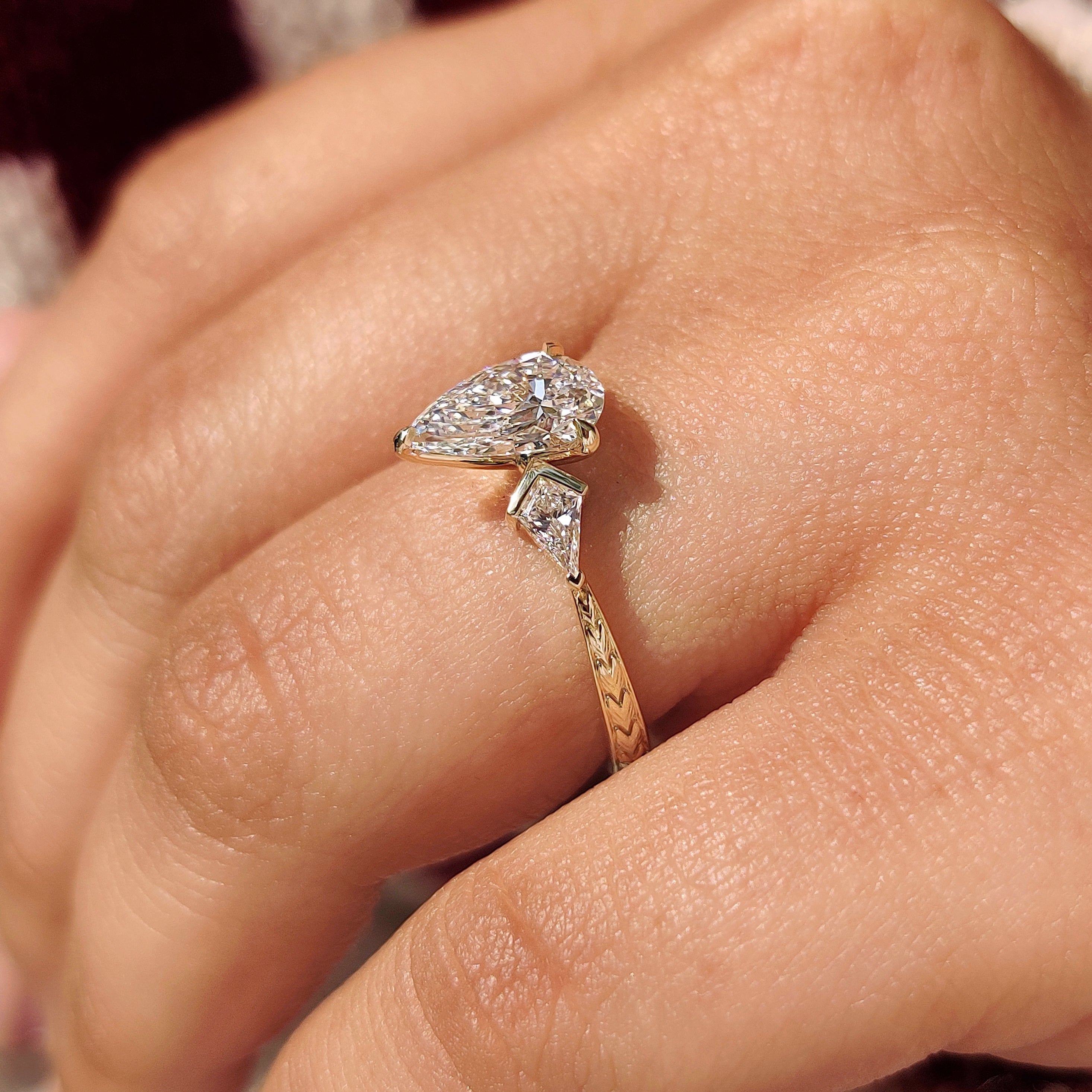 Pear diamond ring with kite side stones handmade.
