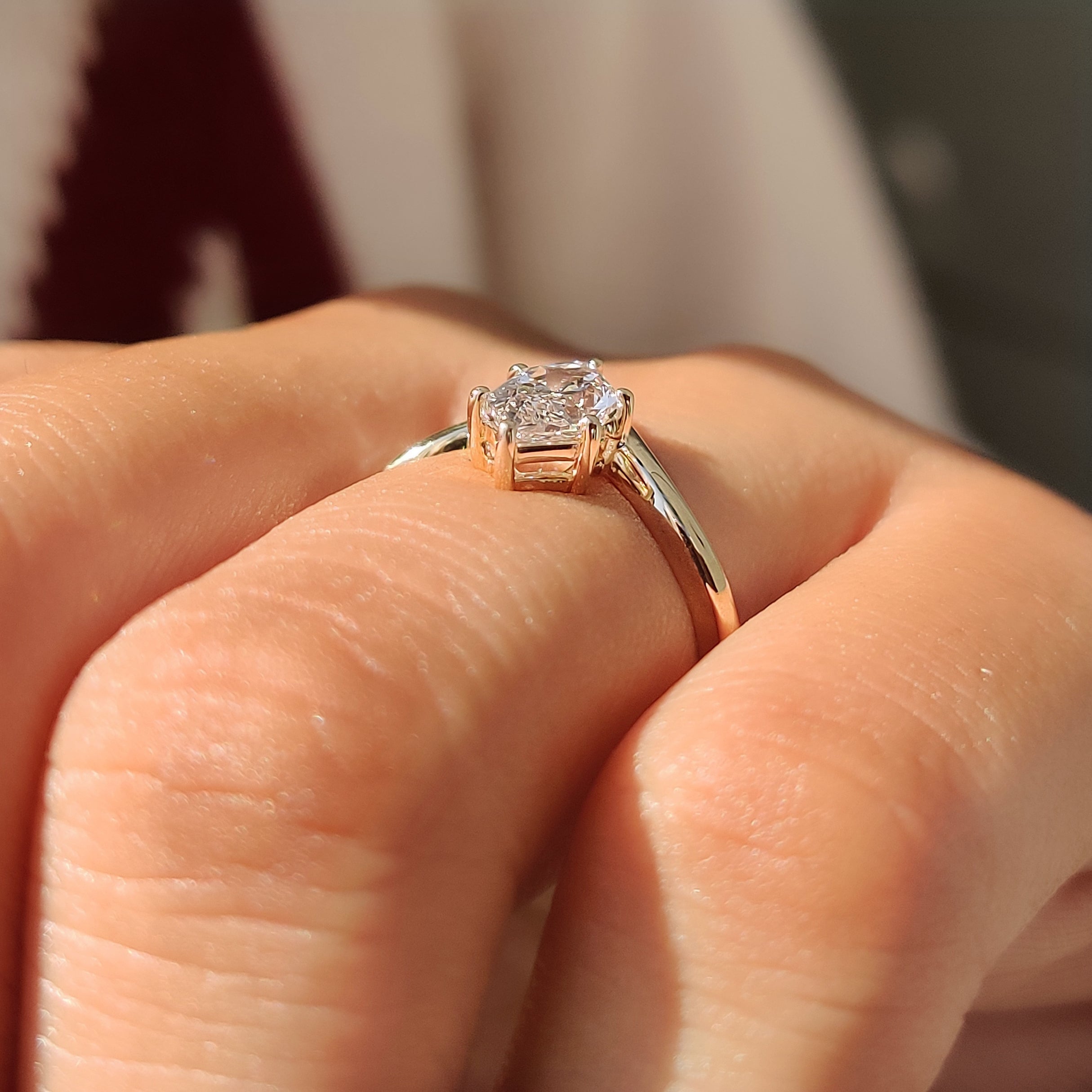 Side view of the open gallery basket on a solitaire ring.

