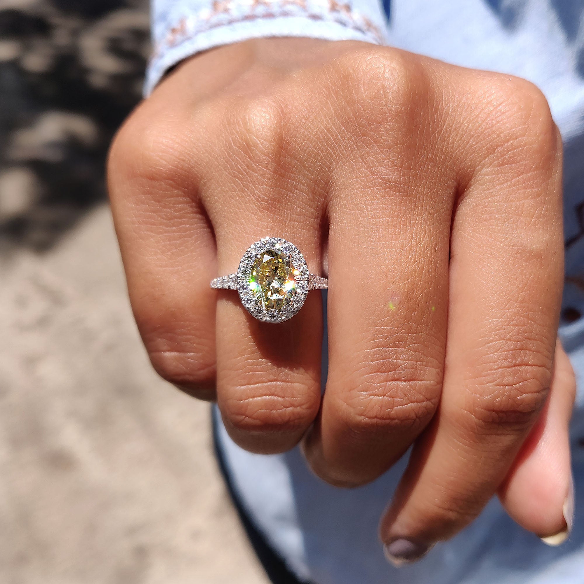 Round cut engagement ring featuring a moissanite stone in a micro pave setting.