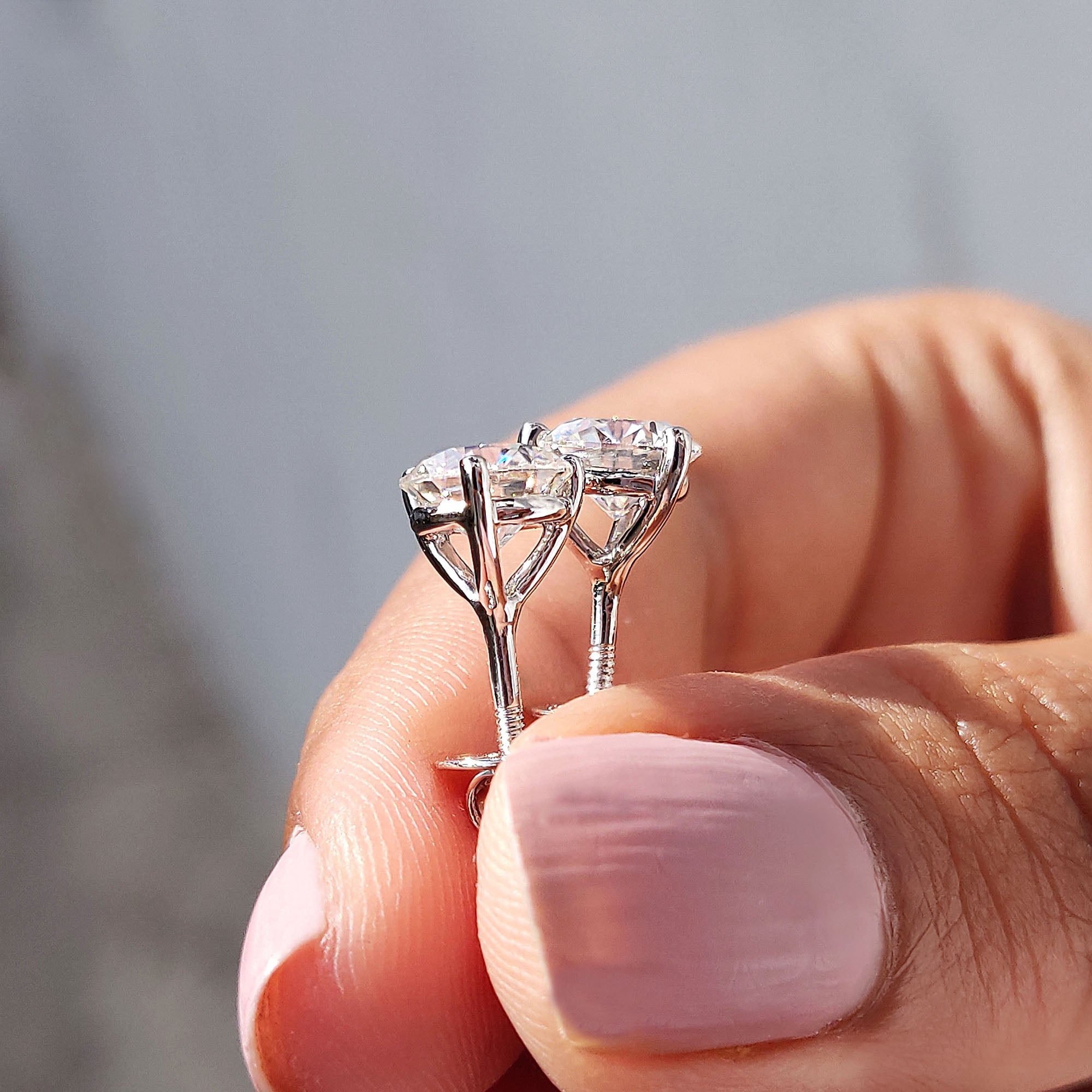 Stud earrings crafted from round cut Moissanite with handmade jewelry quality.
