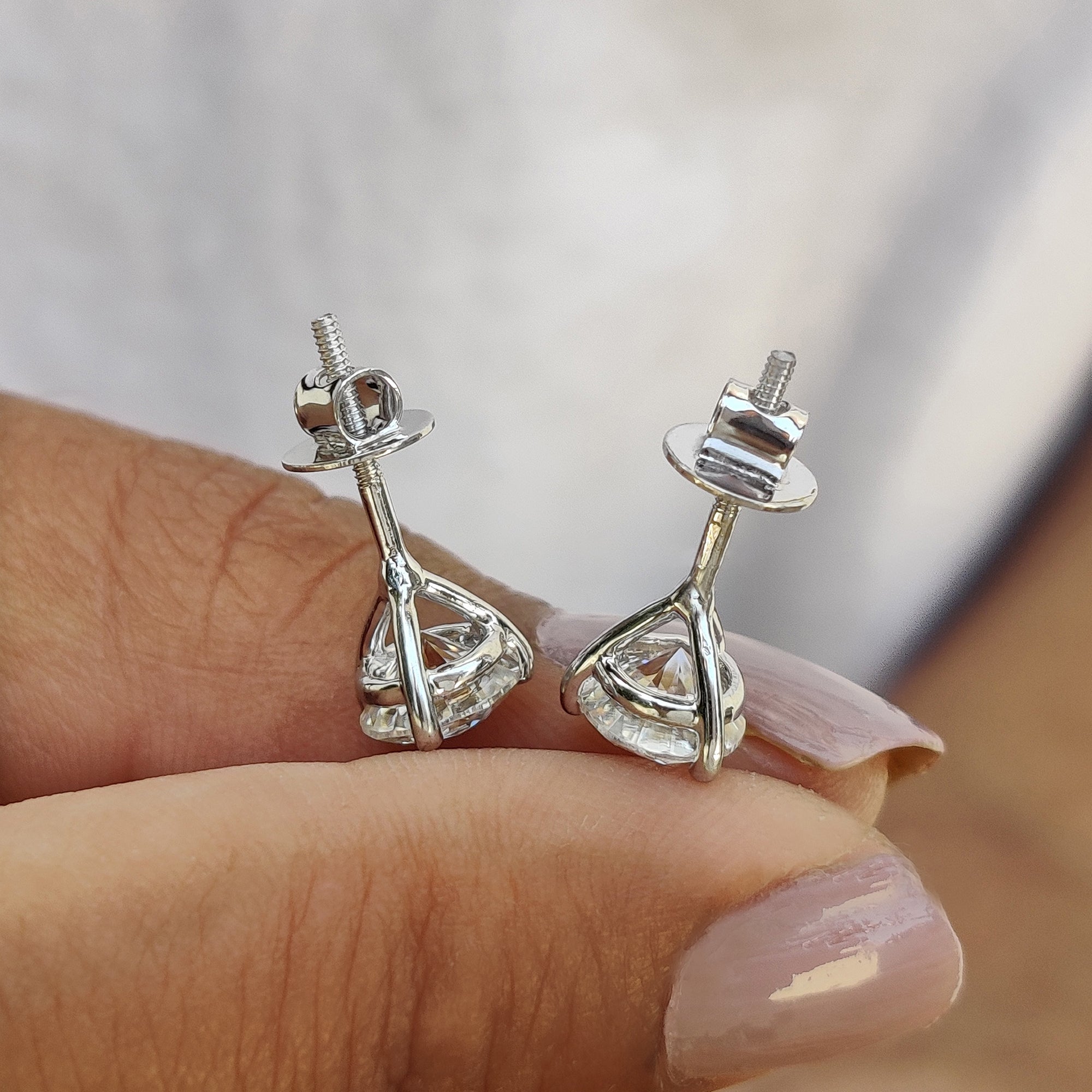 3 prong setting used in handmade earrings with round stud cut earrings for secure fit.

