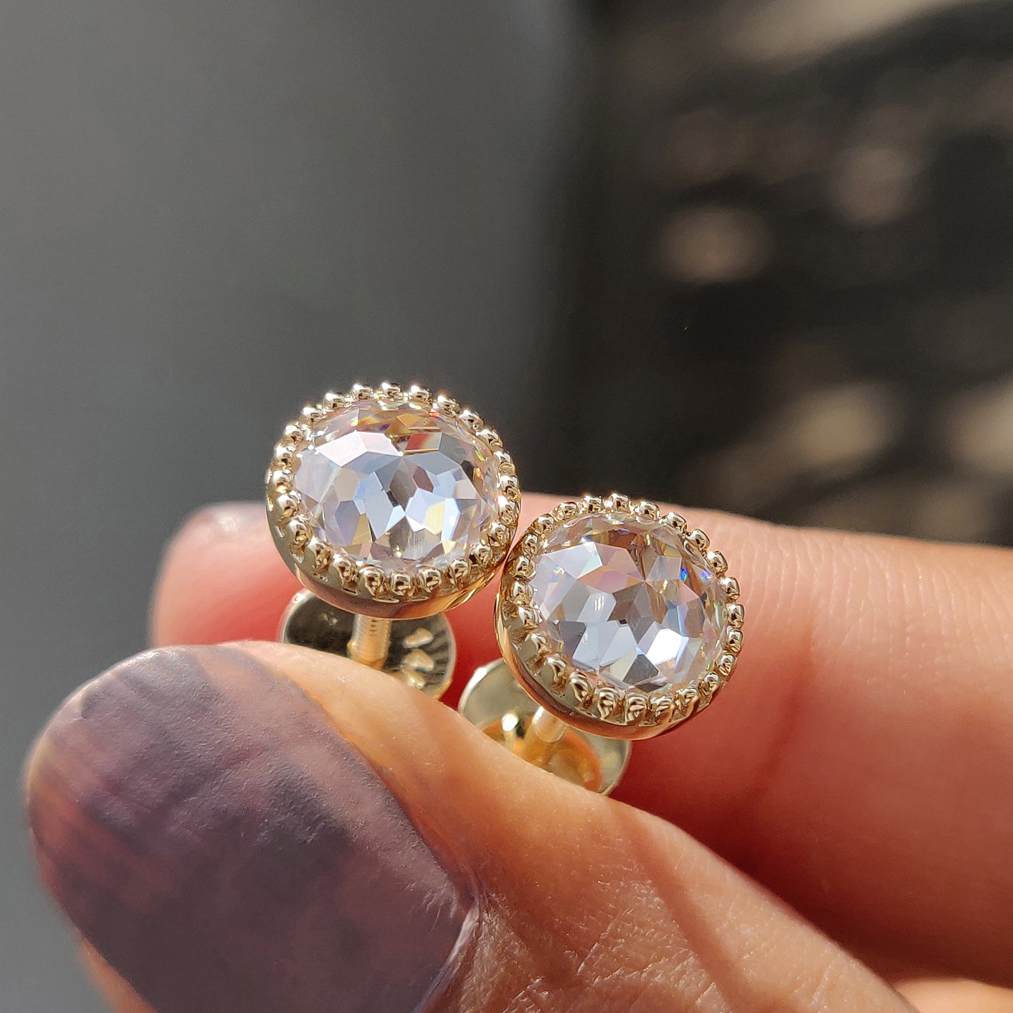 Bezel setting added to round rose cut earrings for a secure and classic look.
